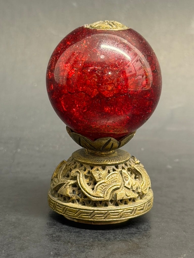 Chinese Qing dynasty Red Crackled Glass Mandarin Hat Finial or hat button: In imperial China, hats were a crucial part of formal dress and the material, color, and design of the finial worn on top directly indicated the wearers specific civil or military rank. The first rank