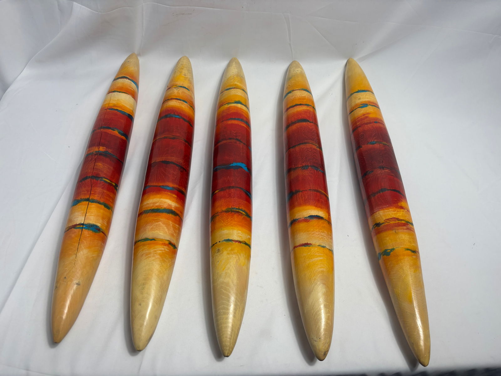 Small Red Prayer Sticks, Family of 5, 2005, John Geldersma: John Geldersma, b. 1943. Geldersma began carving totems and masks in 1970, inspired by African art. His Spirit Poles are carved, smooth, minimalist, vertical, wooden poles with tapered ends, usually