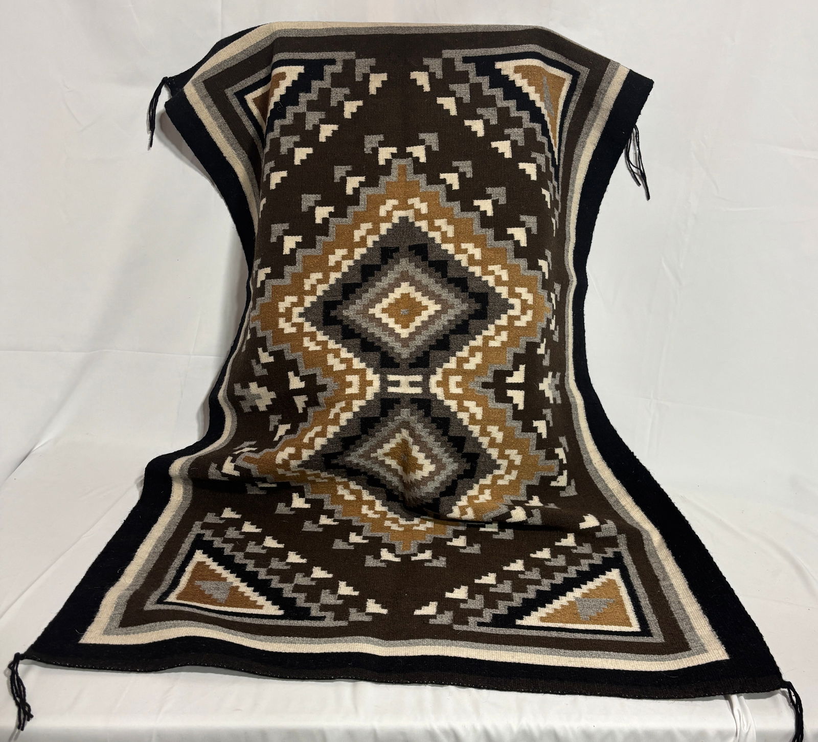 Two Grey Hills Navajo Rug: Two Grey Hills Style Navajo Rug – Tight weave, approximately 64 wefts per inch. This finely crafted rug exemplifies the renowned Two Grey Hills style, celebrated for its intricate geometric