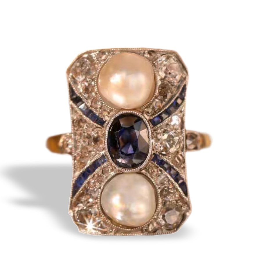 ART DECO PERIOD ANTIQUE RING: Dimensions: approx. size 12, weight: approx. 4.5g. Made in Austria, 18K gold, platinum set with natural wild pearls and unheated Sri Lankan sapphires, old-cut diamonds, and rose-cut diamonds.