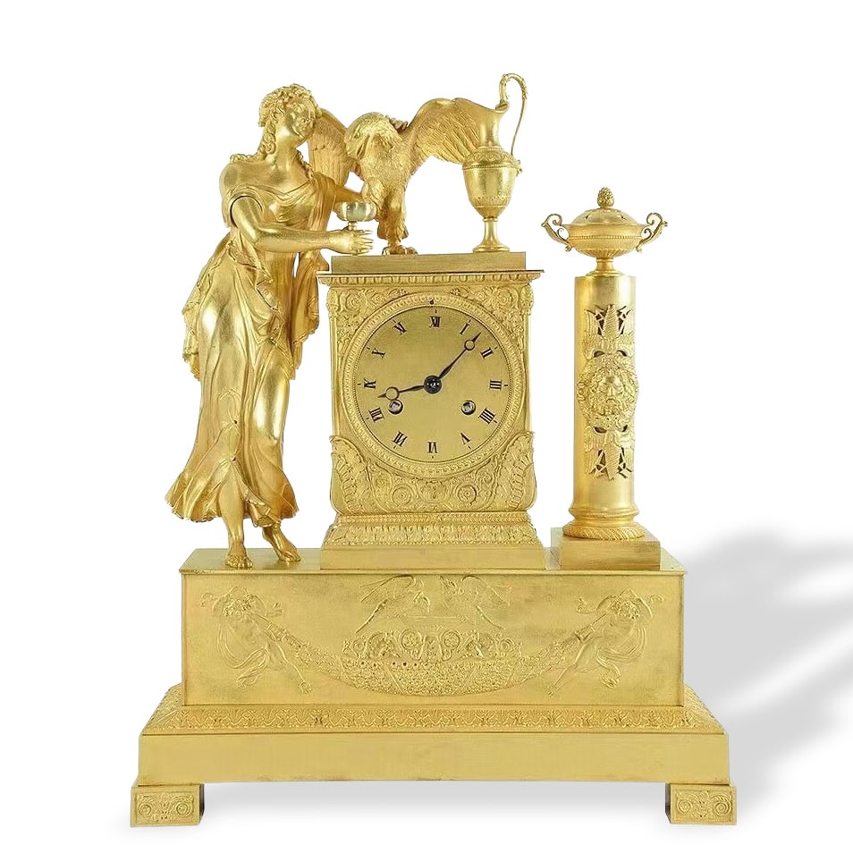 19TH CENTURY FRENCH GILT LARGE CLOCK: Dimensions: Height 40cm (15 3/4 inches), Width 31cm (12 1/4 inches). A 19th-century French gilt large clock with Hebe and Jupiter’s eagle theme. The mythological theme of Hebe, the beautiful goddess