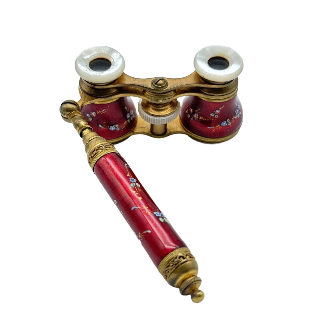 LATE 19TH CENTURY FRENCH PARISIAN-MADE OPERA GLASSES: A late 19th century pair of opera glasses crafted by a Parisian maker, featuring a brass frame and red enamelled telescope tubes with hand-painted cherub and floral decoration. The detailing is finely