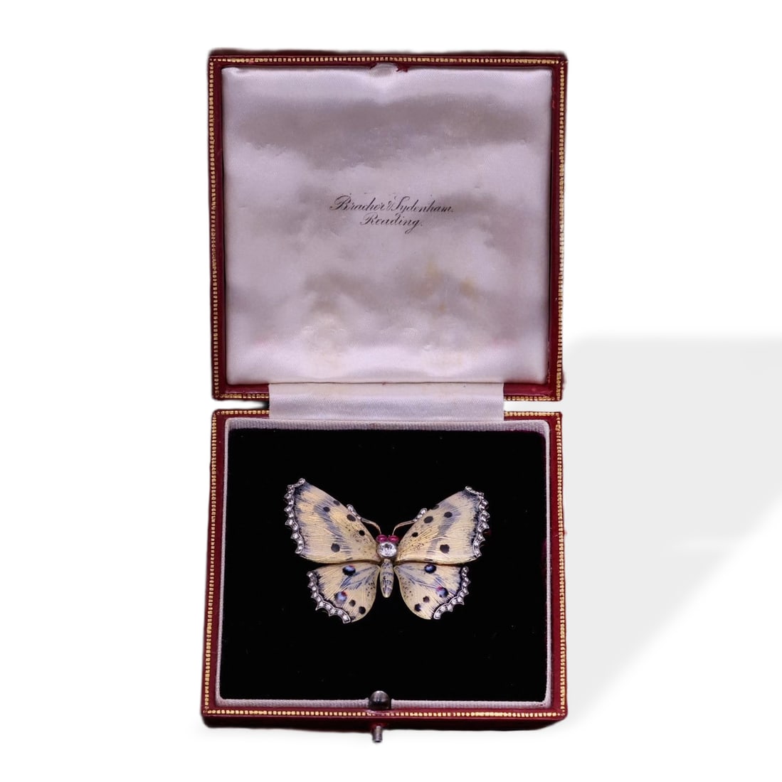 ART NOUVEAU PERIOD 18K GOLD AND ENAMEL BUTTERFLY BROOCH: High-fire plique-à-jour enamel brooch with vivid coloration and fine craftsmanship, set with an old European cut center diamond of approximately 0.4 ct and ruby eyes; weighs 21.39g, dimensions 5 x 0.