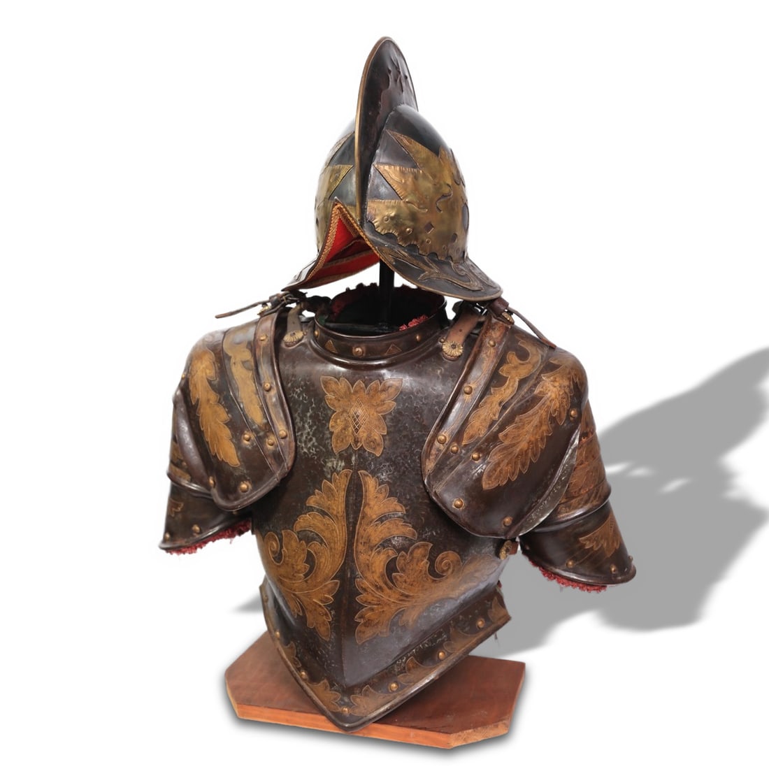 19TH CENTURY GILT ENGRAVED COPPER HELMET AND HALF-ARMOR: Armor total height: 51 cm (20 1/16 in). This 19th-century gilt engraved copper helmet and half-armor represents the artistry and craftsmanship of historical European armor-making traditions. The