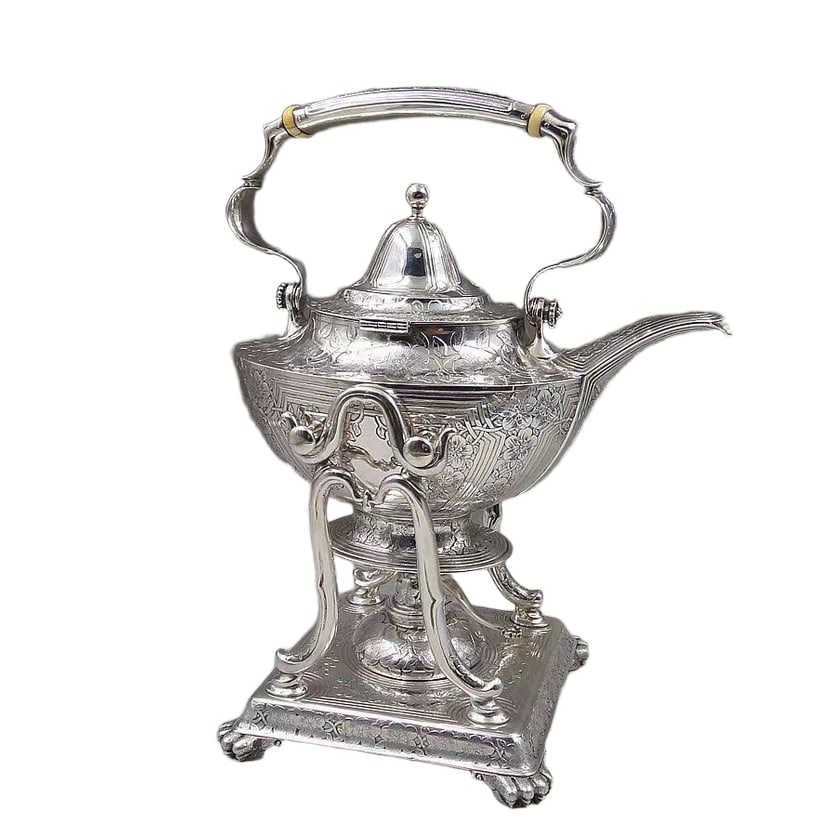 20TH CENTURY TIFFANY SILVER WATER PITCHER: L: 9 1/4 in (23.5 cm); W: 6 5/16 in (16 cm); H: 11 13/16 in (30 cm); Weight: 1.518 kg, Tiffany Silver Water Pitcher, fully engraved with a flattened oval design. Sterling silver with a heat-resistant