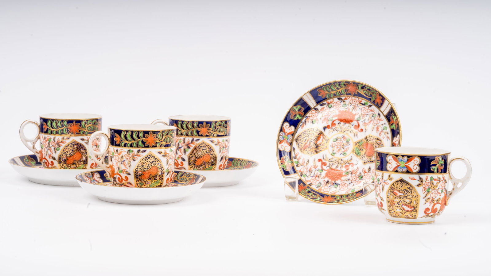 (4) 1877-1890 Derby Crown (Royal Crown Derby) Cups & Saucers: Set of four antique cups and matching saucers by Royal Crown Derby, produced during the esteemed Derby Crown period (1877–1890). These pieces are richly hand-decorated in an early Imari-style palett