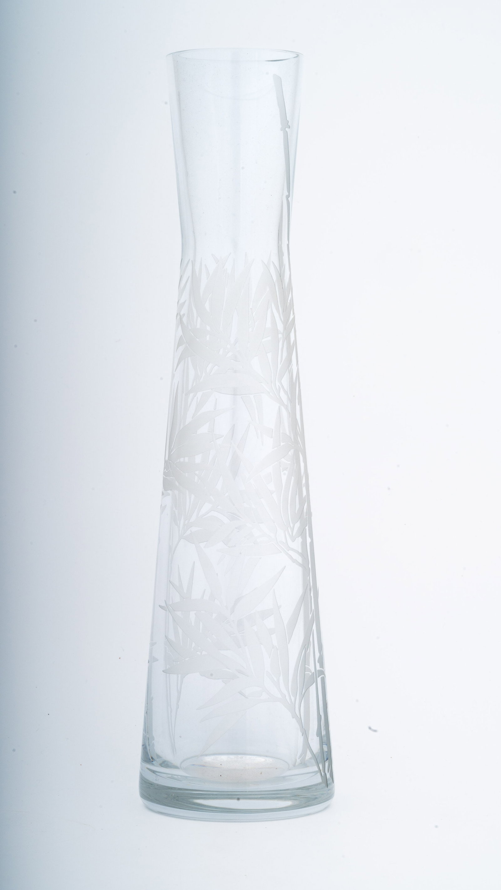 Baccarat Crystal Passion Vase Bamboo: A striking Baccarat lead crystal vase from the Passion collection, featuring a faceted, angular form inspired by bamboo stalks. The precision-cut sides create prismatic reflections, highlighting the c