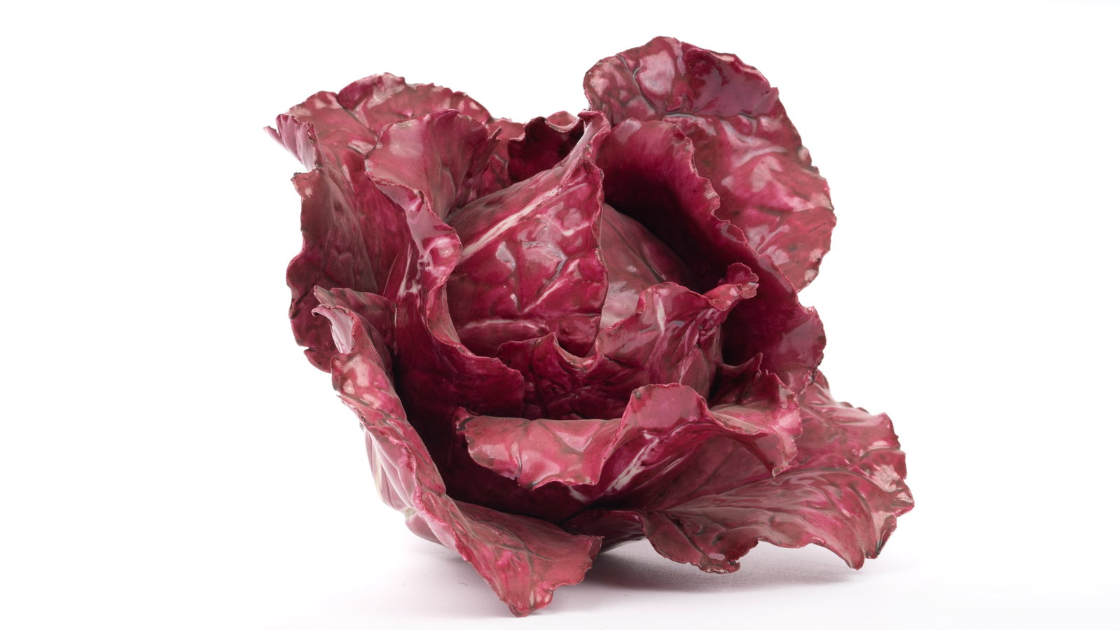 Katherine Houston Porcelain Painted Radicchio/Italian Chicory: An exquisite porcelain sculpture by celebrated American artist Katherine Houston, modeled as a lush head of radicchio or Italian chicory. Hand-painted in rich burgundy and crimson hues with subtle mar
