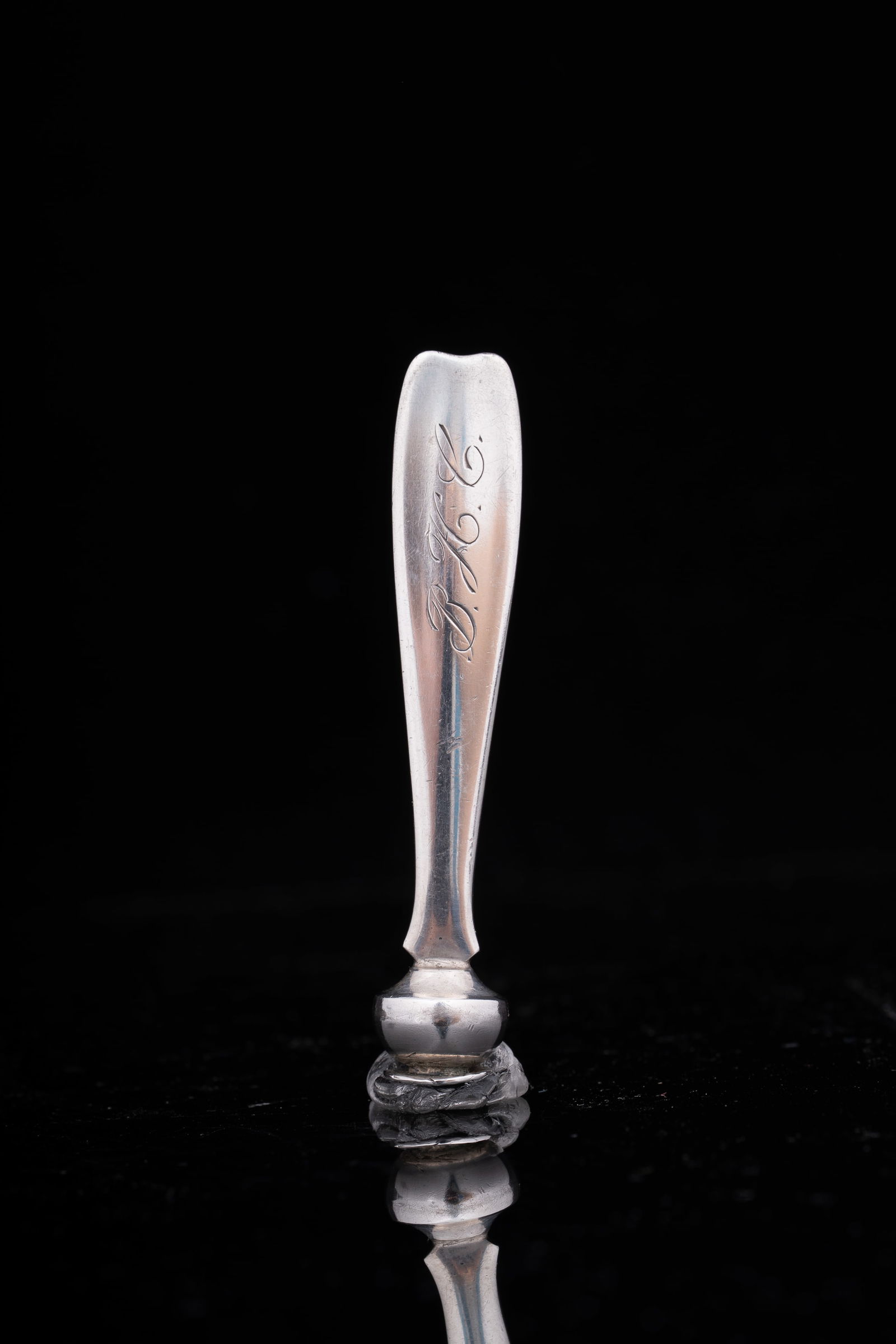 Tiffany sterling silver phone dialer: A Tiffany & Co. sterling silver telephone dialer, of slender tapering form with flared terminal, the handle monogrammed ‘P.M.C.’ and the tip fitted with original hook. Marked ‘Tiffany & Co. / St