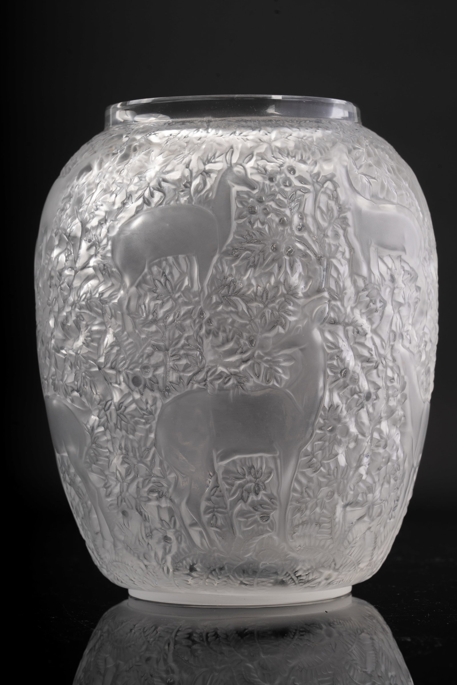 Rene Lalique Frosted Glass Biches Deer Vase: An early Lalique frosted glass vase finely molded in relief with deer or antelope amidst dense foliage. The surface shows Lalique’s signature balance of naturalism and stylization, with a satin fini