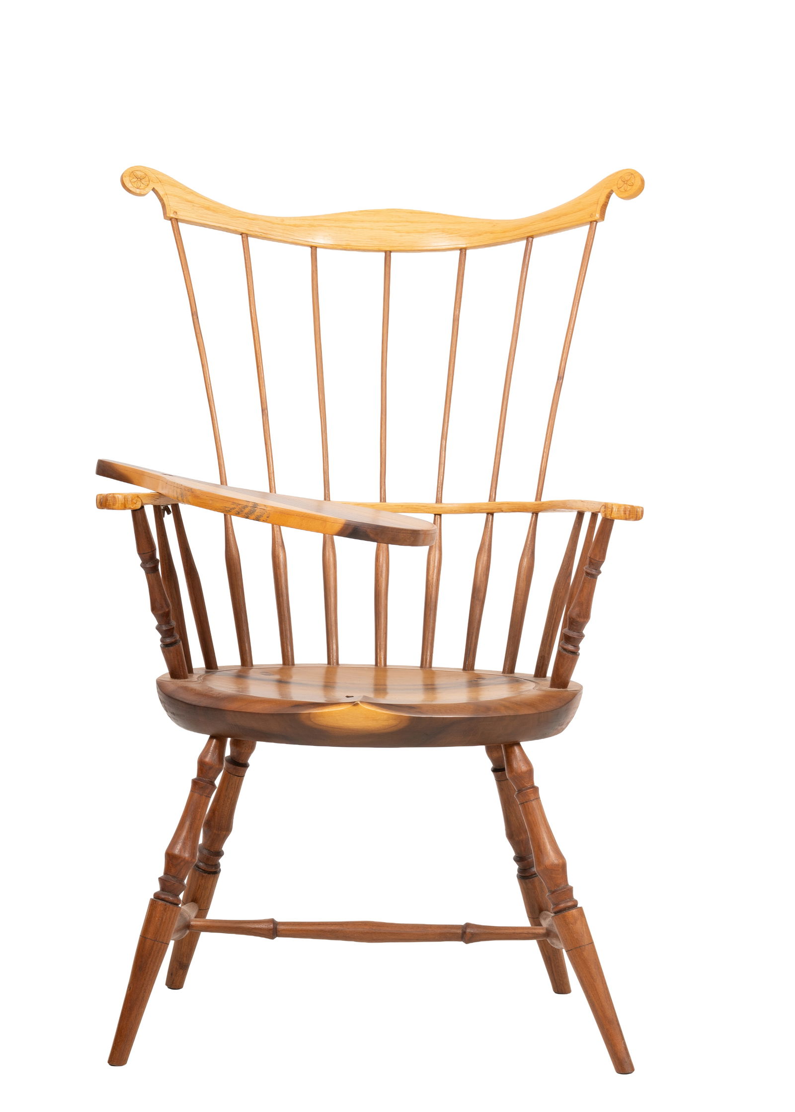 J. Quick Handcrafted Comb-Back Windsor Armchair, Signed: Handcrafted comb-back Windsor armchair in two-tone hardwood with a shaped crest rail featuring carved rosette medallions on scrolled ears, seven tapered spindles, shaped arms with matching rosette ter