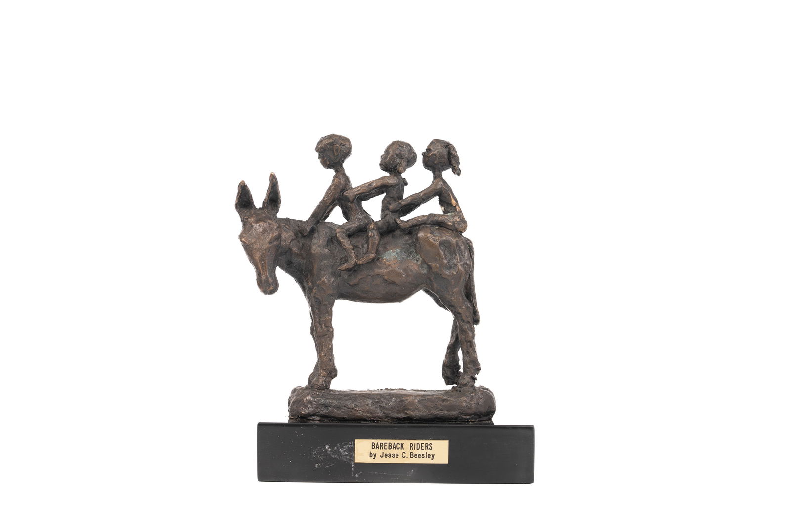 JESSE C. BEESLEY (American, 20th Century) Bareback Riders Bronze Sculpture: Figural bronze sculpture depicting three children seated bareback on a donkey, mounted on a rectangular base with engraved plaque reading "Bareback Riders by Jesse C. Beesley." The composition capture