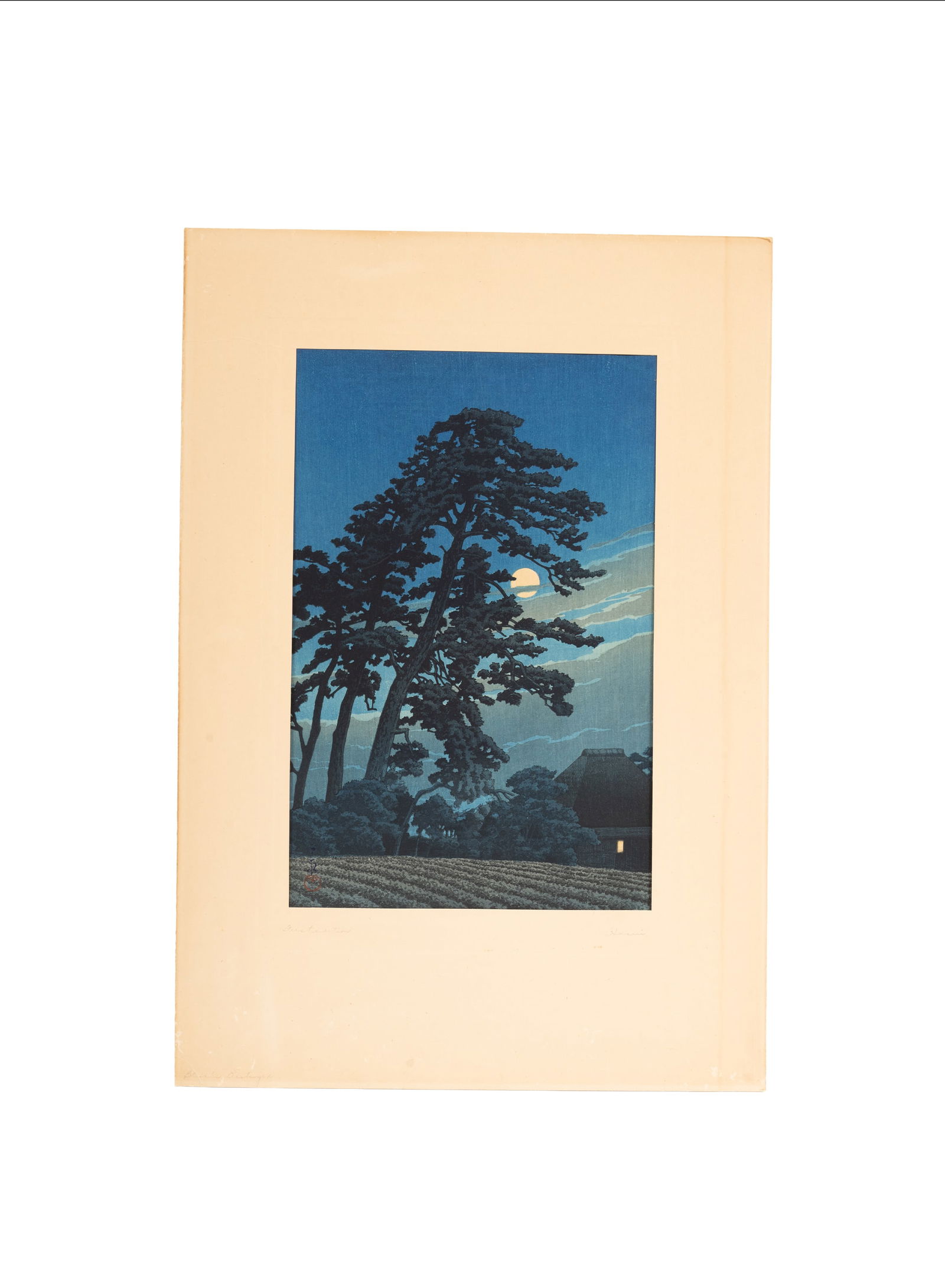 KAWASE HASUI (川瀬巴水 , Japanese, 1883-1957) Full Moon at Magome Woodblock: A Japanese shin-hanga color woodblock print depicting a moonlit rural landscape with tall pines beside a farmhouse at night, rendered in deep blue tones characteristic of Hasui's atmospheric evening s
