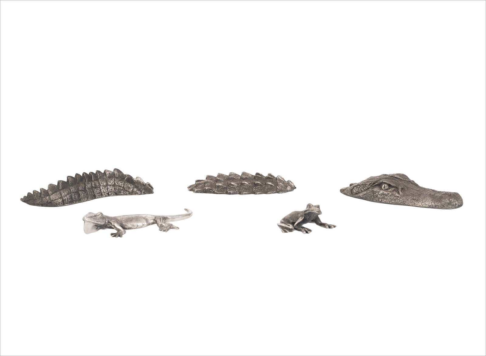 M. Woodward Cast Aluminum Reptile and Amphibian Miniature Sculptures: Group of cast aluminum animal form miniature sculptures including frog, lizard, and two alligator figures rendered with textured naturalistic surface detail. Each piece bears the M. Woodward signature