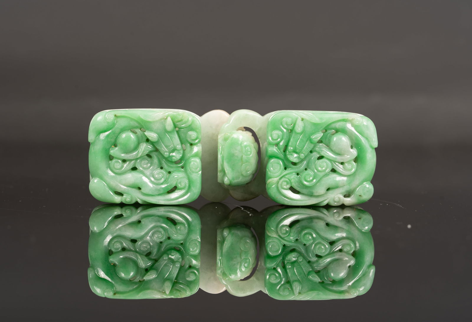Chinese Carved 2 Piece Jade Belt Hook Chilong Dragon: A finely carved Chinese jade belt hook of rectangular form, each side decorated in openwork with stylized chilong dragons amid scrolling clouds. The stone of vivid apple-green tone with lighter