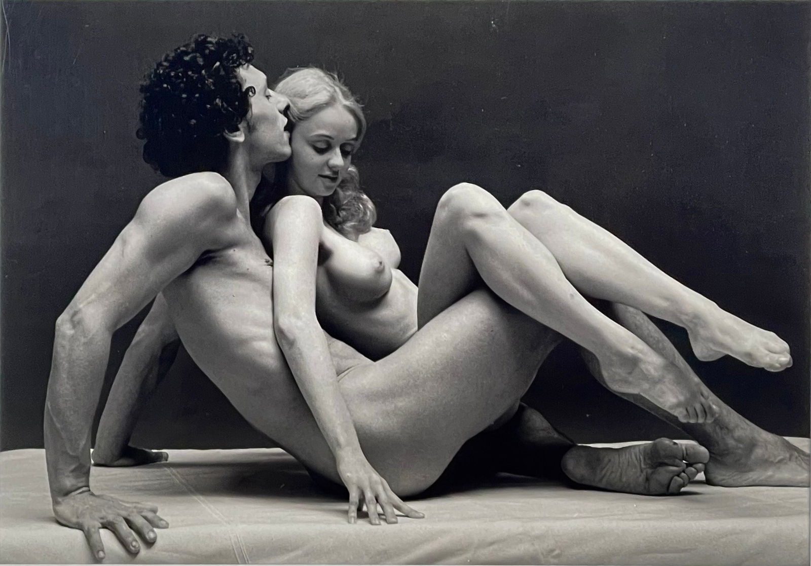 Andre de Dienes (Hungarian, 1913-1985), Couple Seated. 281 SIlver Gelatin Print: Couple Seated. 281 silver gelatin print by Andre de Dienes. Handstamp on verso. Handling marks. Print size 9 1/4" x 12 7/8". Mat size: 12 3/4" x 16 1/2". Includes Certificate of Authenticity from Andr