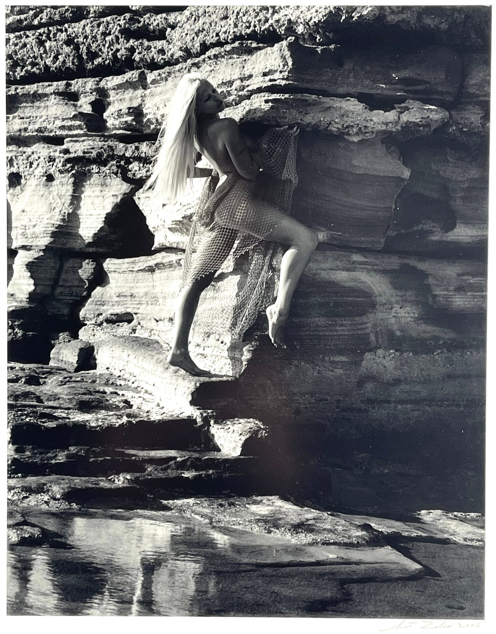 Art Zilio (American 1946-), Leann of Lindos Rhodes Silver Gelatin Print: Leann of Lindos Rhodes silver gelatin print signed and dated on recto and verso by Art Zilio. 2006. Image size: 12" x 9 3/8". Frame size: 21 5/8" x 19 1/8". Weighs 5.85 lbs
