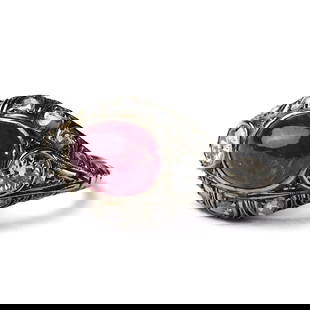 A RUBY AND DIAMOND RING, POSSIBLY LATE 19TH CENTURY: A RUBY AND DIAMOND RING, POSSIBLY LATE 19TH CENTURY Dimensions: Band Width: 19 mm, Top Face: 7.8 × 9.8 mm, Weight: 2 g This stunning ring from the late 19th century features a central, oval-shaped