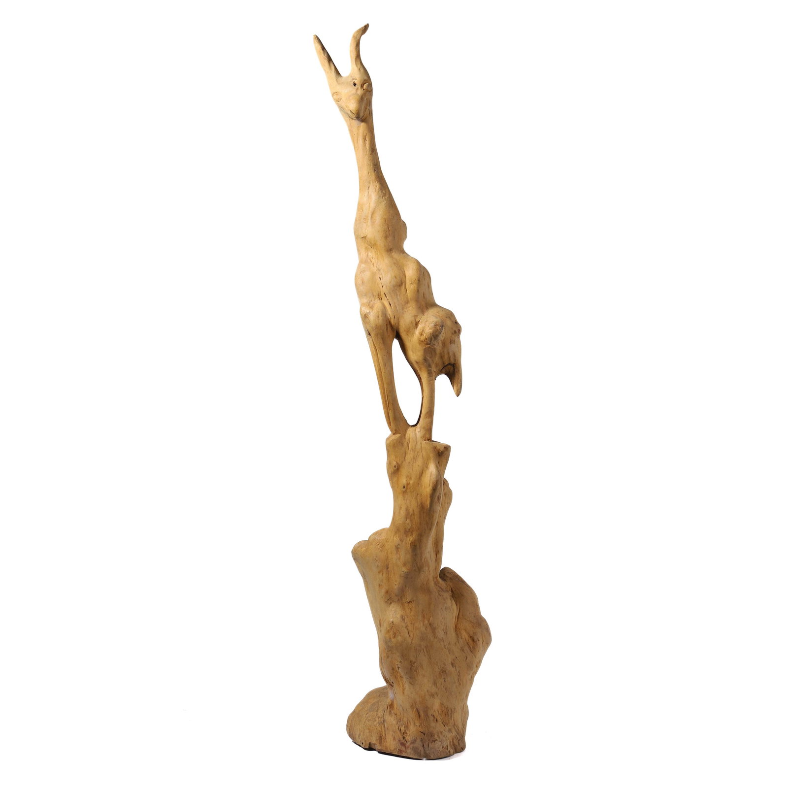 A NATURAL WOOD CARVING OF A STYLIZED ANIMAL: height: 29 1/8 in (74 cm) A beautifully carved natural wood sculpture, possibly depicting a stylized animal with elongated features and abstract form. The piece showcases the organic texture and intri