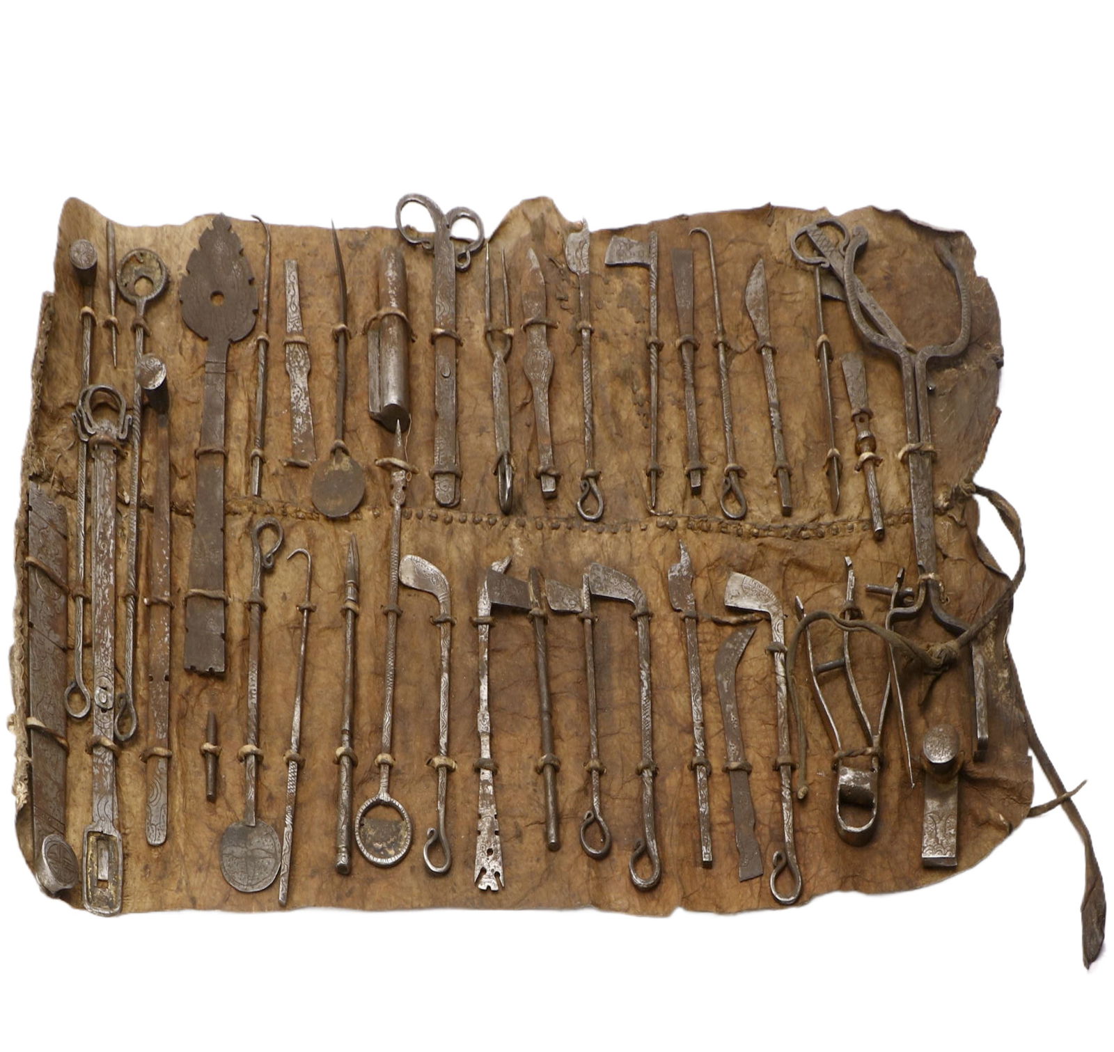 Qing Dynasty Mongolian-Tibetan Iron Surgical Instrument Set: Size Vary This Qing Dynasty Mongolian-Tibetan Iron Surgical Instrument Set is exquisitely crafted. Composed of 39 hand-forged iron surgical tools with an original leather storage carrier, the instrume