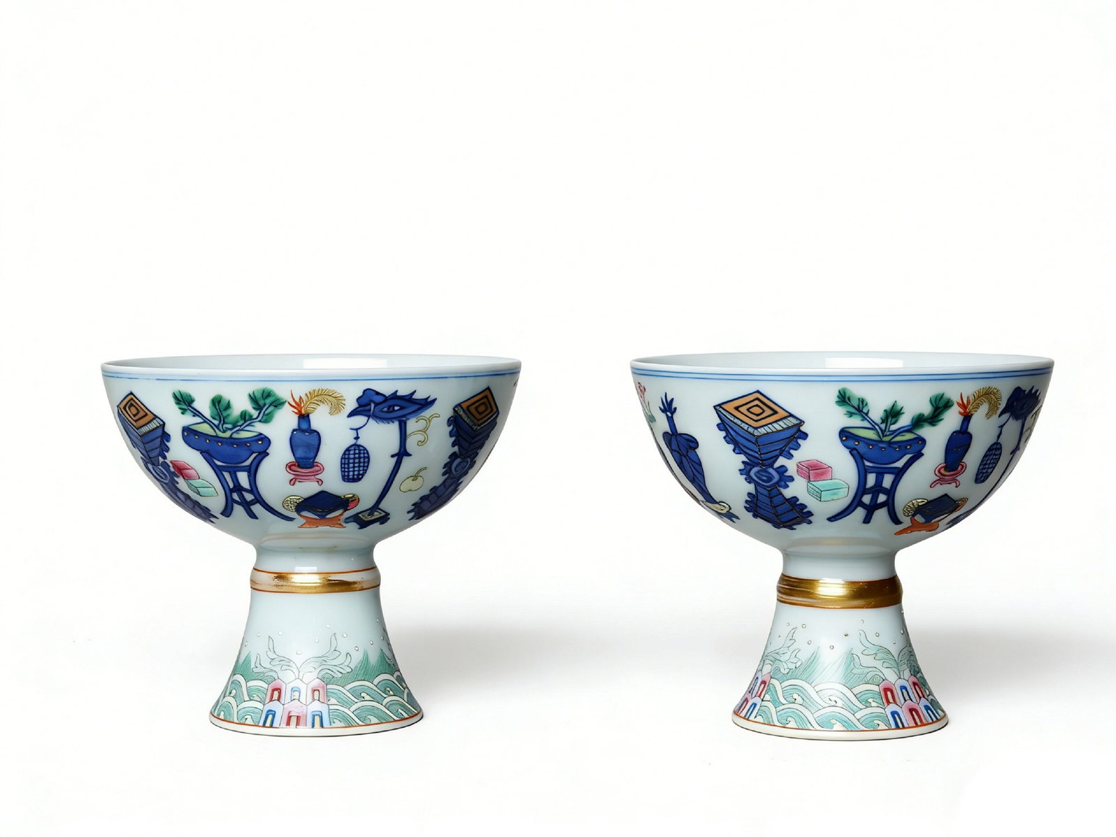 Qing Qianlong Period Doucai "Courtyard Figure" Stem Cups (A Pair): H:9cmW:11cmThis pair of Qing Qianlong Period Doucai "Courtyard Figure" Stem Cups is a fine imperial wine vessel. The porcelain body is delicate and white, decorated with doucai courtyard figure patter