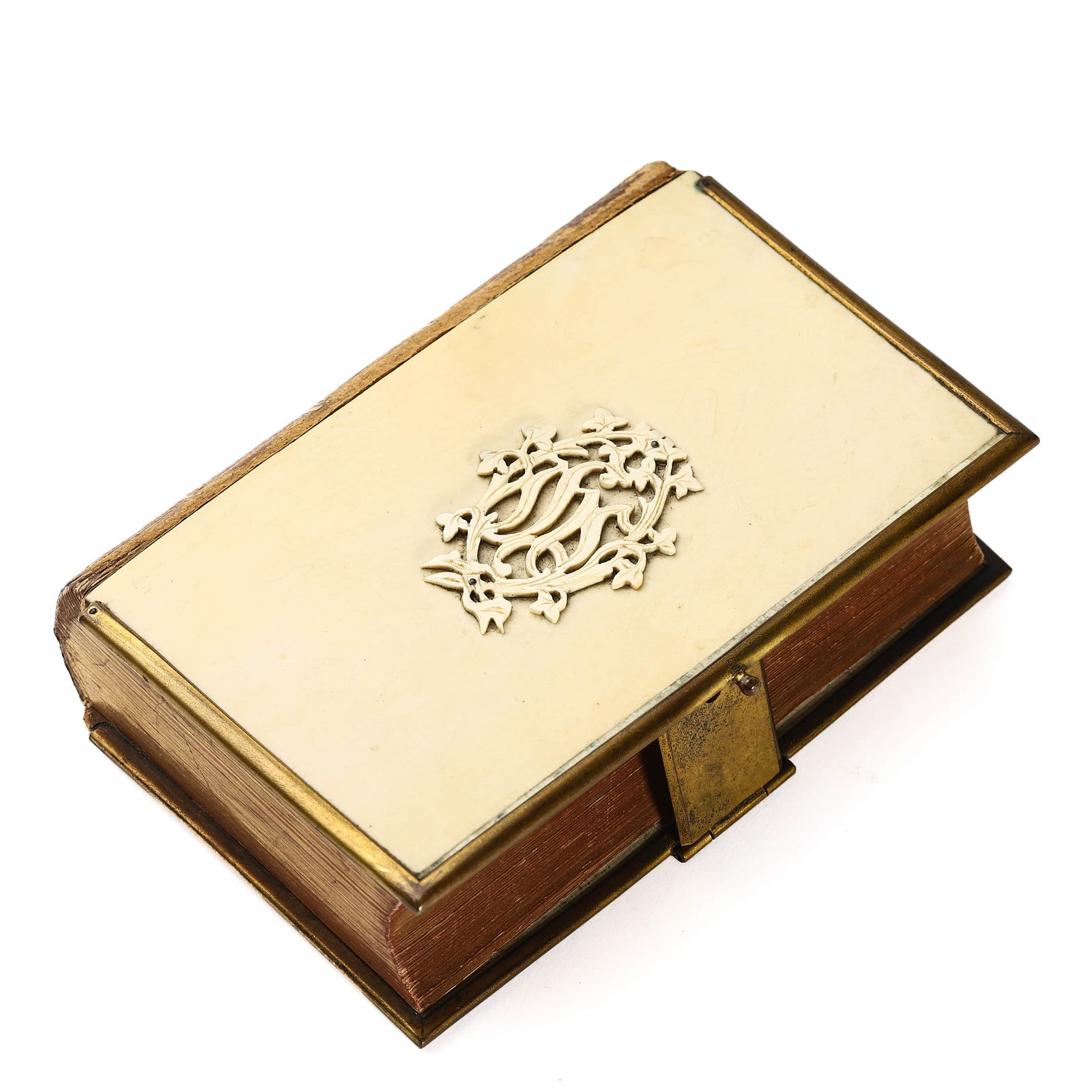 A VICTORIAN GILT-EDGED PRAYER BOOK WITH CARVED BONE COVER.: Dimensions: 5 1/8 × 3 1/2 in. (13 × 9 cm) This English prayer book features a finely carved bone front cover with an ornate monogram and ivy motif. The clasp, mounts, and page edges appear to be gil