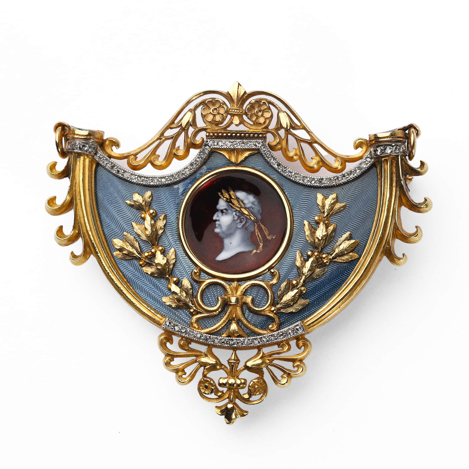 A FRENCH ART NOUVEAU 20K GOLD AND ENAMEL BROOCH-PENDANT, COMMISSIONED BY NOBILITY, WITH A MINIATURE: Dimensions Length: 2 1/16 in. (52 mm); Width: 1 13/16 in. (46 mm); Weight: 28.5 g Description: Exquisitely handcrafted in 20k gold, this brooch-pendant centers a finely painted enamel portrait of Empe