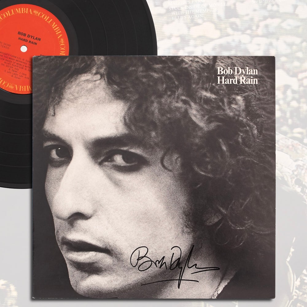 BOB DYLAN SIGNED "HARD RAIN" VINYL RECORD: 12 1/4 x 12 1/4 in Provenance and Authentication: This collectible has undergone a rigorous forensic evaluation. The signatures were carefully analyzed across multiple criteria, including ink depositi