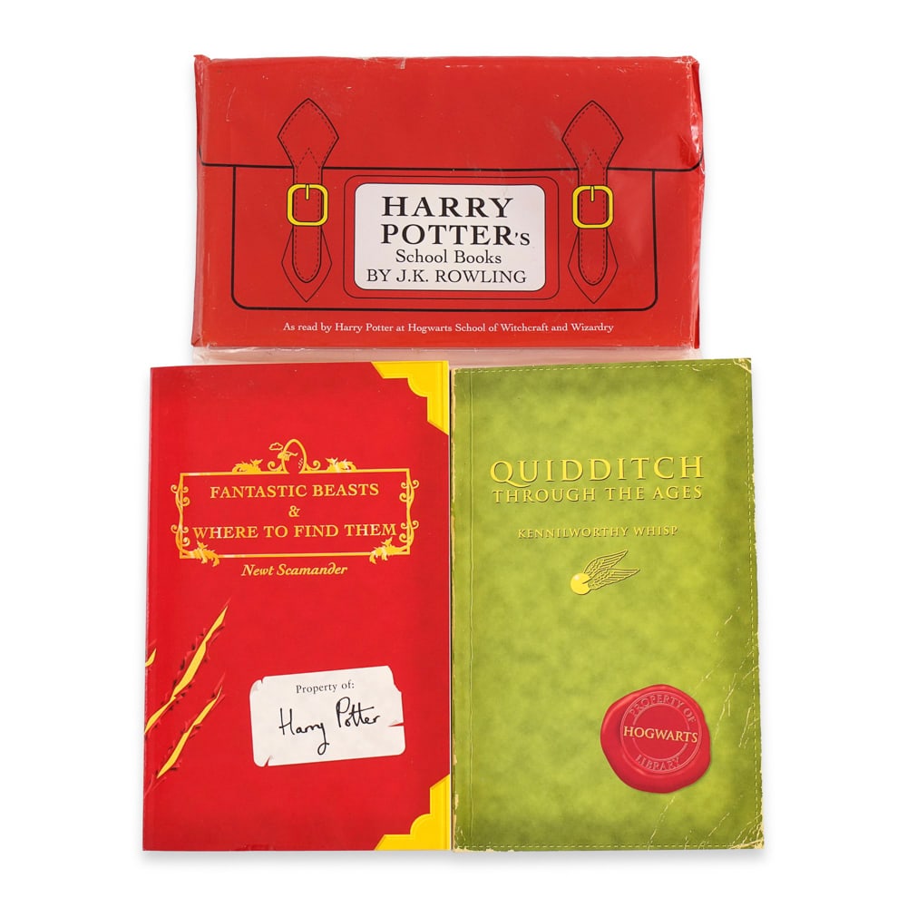 J.K. ROWLING SIGNED HARRY POTTER'S SCHOOL BOOKS: 7 x 4 3/8 in (17.7 x 11 cm) This signed set of Harry Potter's School Books comprises two companion volumes authored within the fictional Hogwarts universe: Fantastic Beasts and Where to Find Them and