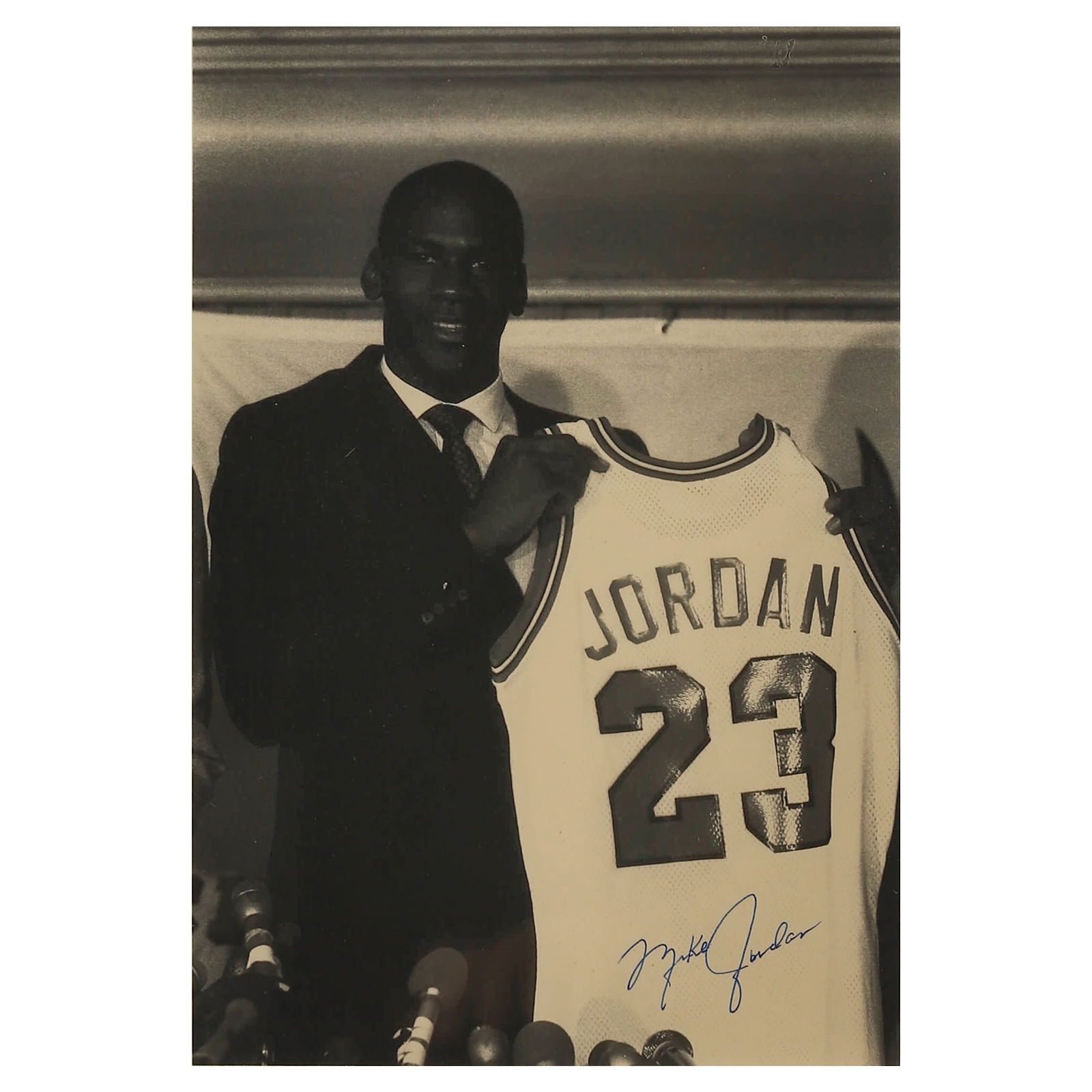 MICHAEL JORDAN, MICHAEL JORDAN HOLDING HIS NO. 23 JERSEY, CIRCA 1984 (1 of 3)