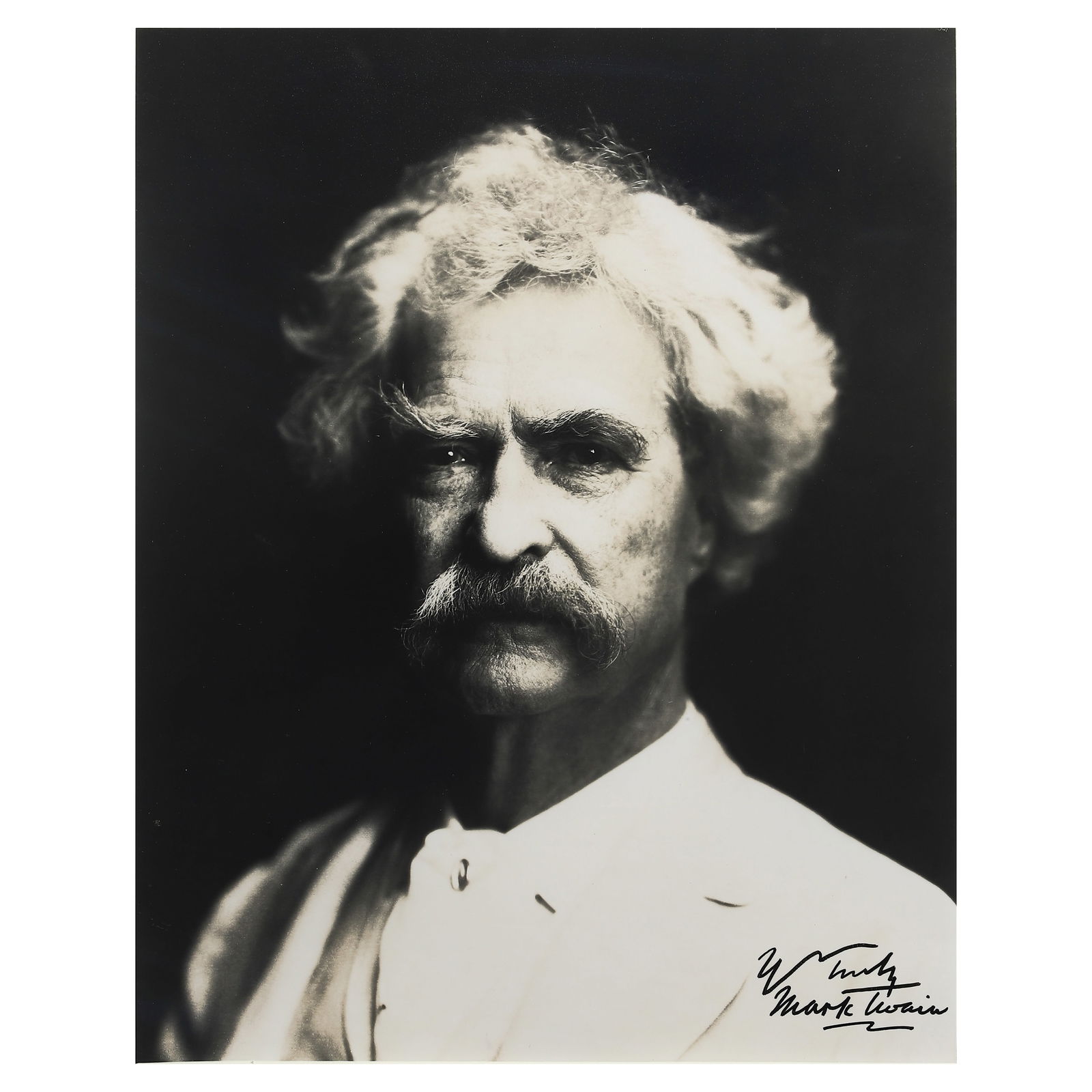 MARK TWAIN PORTRAIT PHOTOGRAPH: Title MARK TWAIN PORTRAIT PHOTOGRAPH Material Gelatin silver print, mounted on board Signature Signed in black ink by Mark Twain at the lower right Dimensions Photograph 9 1/16 × 11 7/16 in. (23 × 2