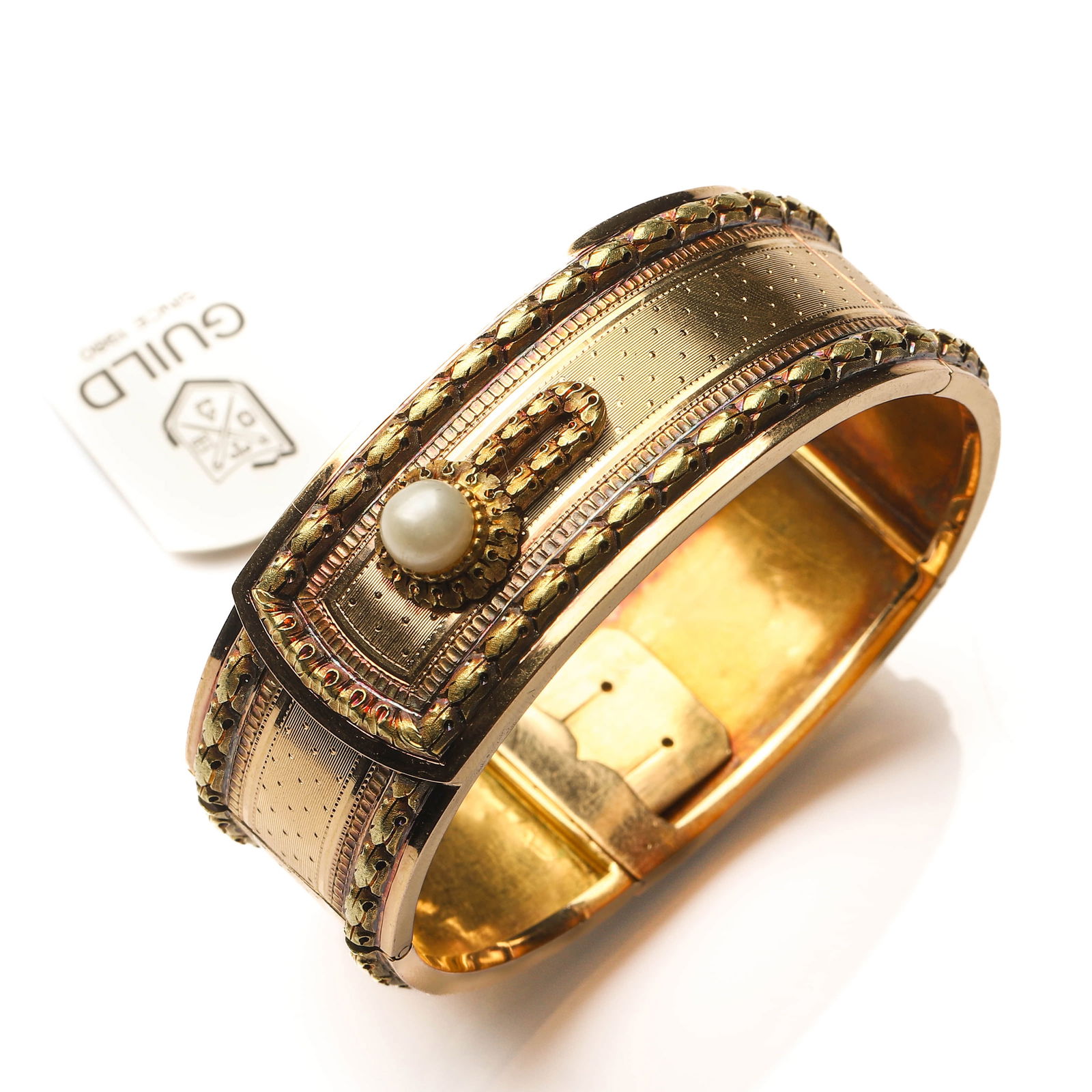 NAPOLEON III FRENCH MULTICOLORED CHASED GOLD AND NATURAL PEARL BANGLE BRACELET: Dimensions Inner diameter adjustable approx. 1 7/8–2 5/16 in. (48–58 mm), suitable for wrist circumference up to approx. 6 1/4 in. (16 cm).Weight: approx. 41 g. Description This exceptional French