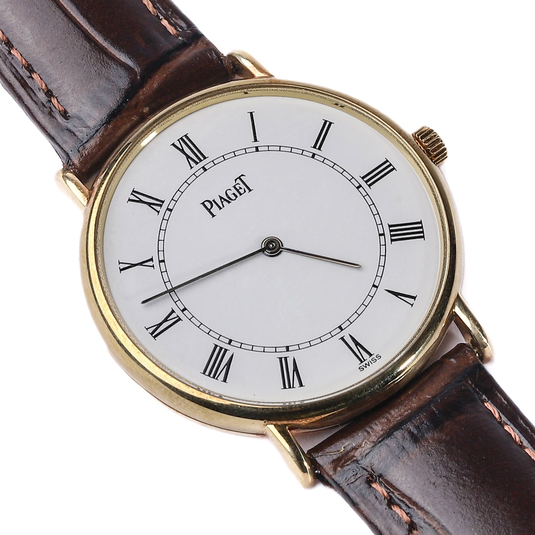 PIAGET 18K YELLOW GOLD WRISTWATCH, MODEL 9065 N, MANUAL WINDING: Dimensions: Case diameter 1 5/16 in. (33.1 mm); Total length 8 5/8 in. (22 cm) An elegant Piaget wristwatch in 18K yellow gold, featuring a classic white dial with black Roman numeral hour markers and