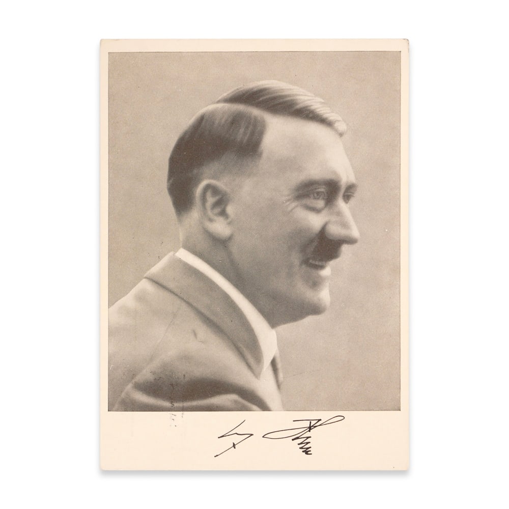 ADOLF HITLER SIGNED POSTCARD: 5 3/4 x 4 1/8 in (14.7 x 10.5 cm) This signed postcard represents a historical artifact from one of the most consequential and documented periods of the twentieth century. The postcard features a form
