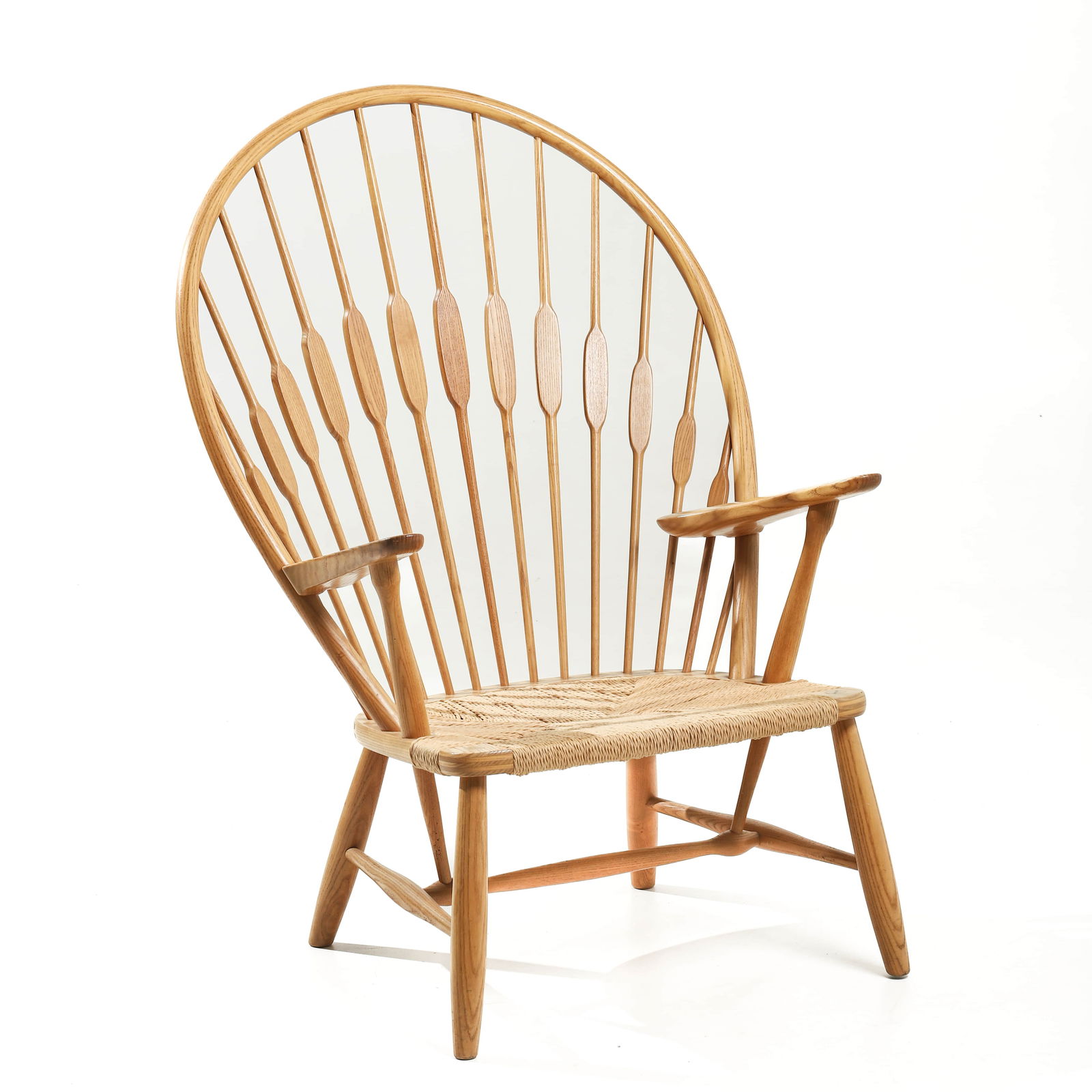 HANS J. WEGNER FOR JOHANNES HANSEN “PEACOCK CHAIR”: Dimensions: 19 11/16 × 27 1/8 × 41 5/16 in (50 × 69 × 105 cm) Description Designed by Hans J. Wegner and crafted by Johannes Hansen in Copenhagen, this iconic “Peacock Chair” features a