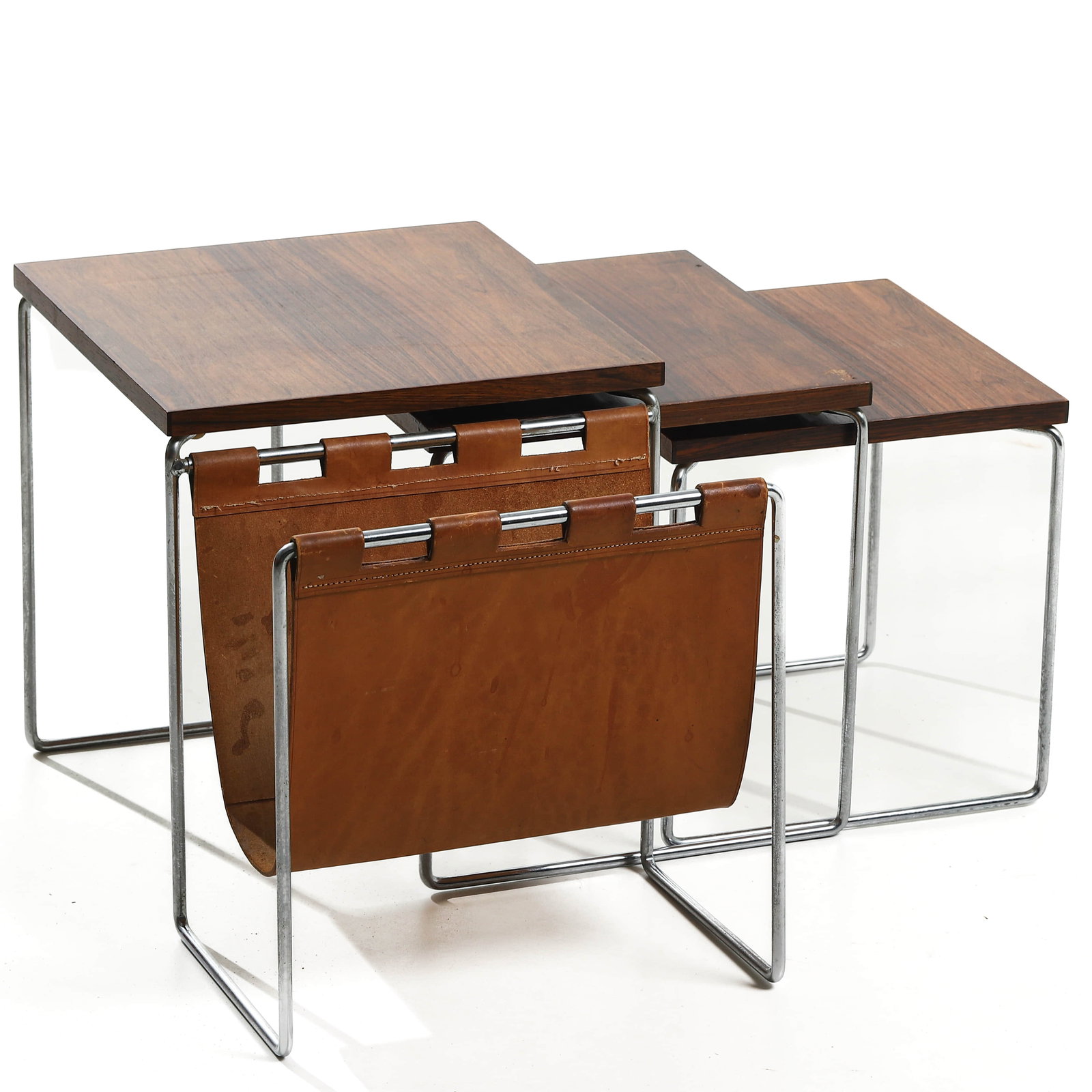 BRABANTIA NESTING TABLES WITH MAGAZINE HOLDER, NETHERLANDS, 1960s: Dimensions Length 22 1/16 in. (56 cm), Width 13 3/4 in. (35 cm), Height 14 9/16 in. (37 cm) Description Produced in the 1960s by Dutch manufacturer Brabantia, this set of three nesting tables