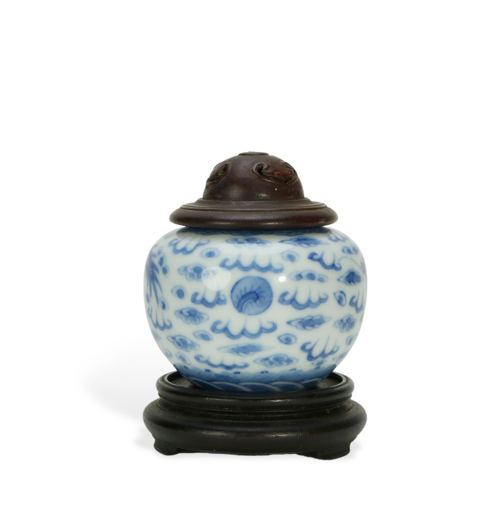 Small Blue - and - white Covered Jar with Cloud Patterns (with Redwood Stand and Cover): H:7.5cm W:6.5cm This is a small blue - and - white covered jar with cloud patterns, equipped with a redwood stand and cover. The jar body has a small and round shape, and the body is delicate. The