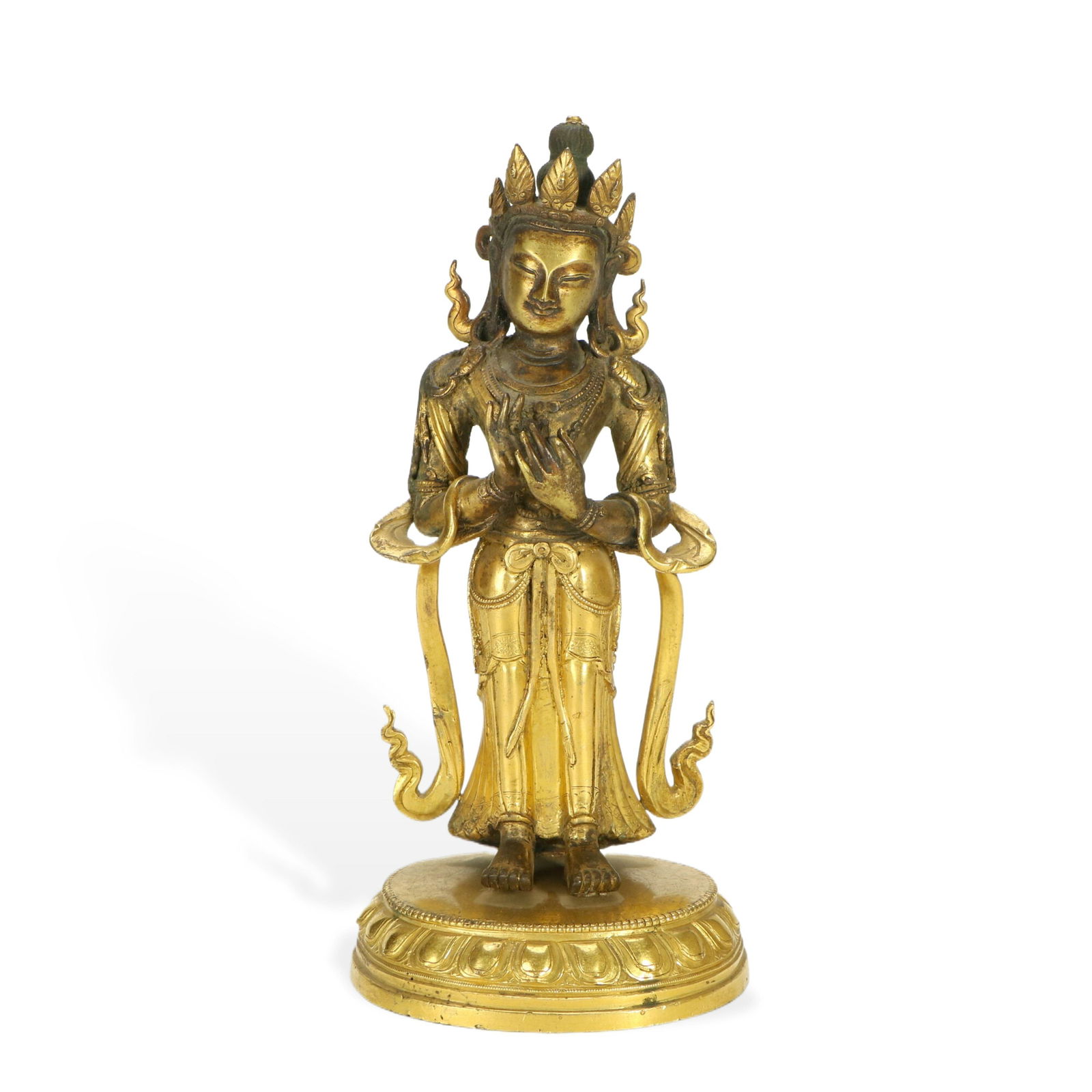 Gilt - bronze Standing Figure of Avalokiteshvara: H:20.5 W:9.5cm This is a gilt - bronze standing figure of Avalokiteshvara. Avalokiteshvara stands, with a serene face, wearing a delicate crown and gorgeous garlands, and hands making mudras, with