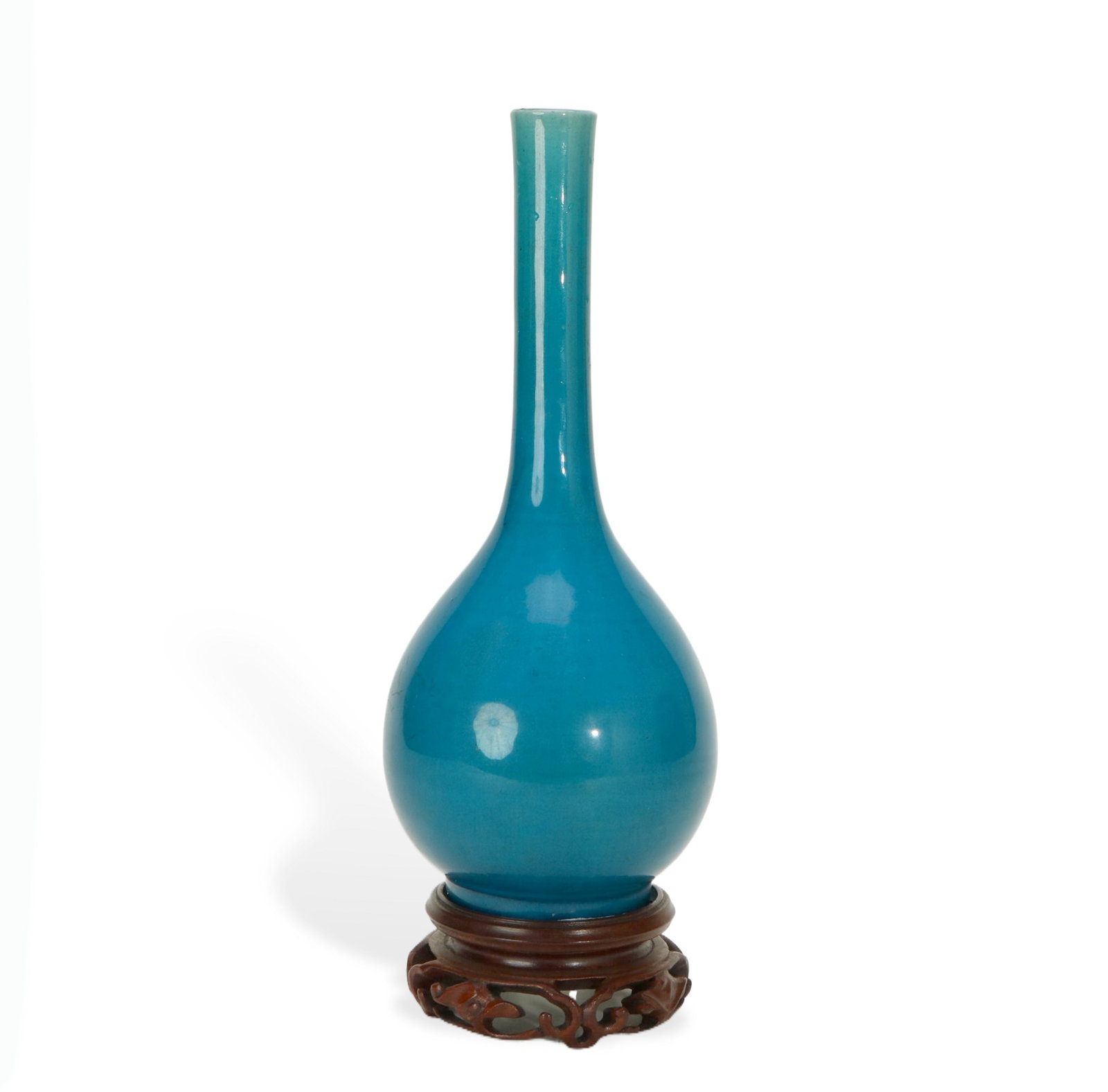 Peacock Blue - glazed Long - necked Vase (with Redwood Stand): H:27cm W:9cm This is a peacock blue - glazed long - necked vase, equipped with a redwood stand. The vase has a slender and beautiful shape, smooth lines and delicate body. It is covered with