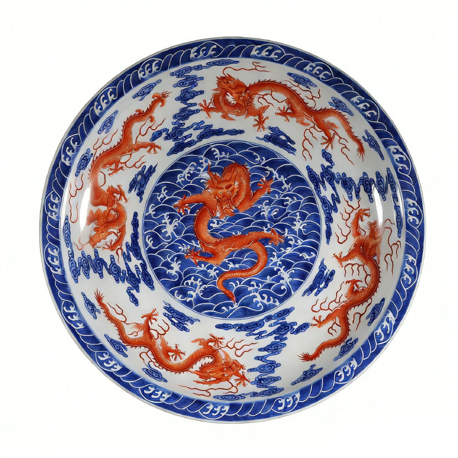 A Large Qing Qianlong Blue and White Iron-Red 'Five Dragons' Charger: H?9cm W:50.8cm This magnificent charger is a superb example of Qianlong-period imperial porcelain. The entire surface is masterfully decorated in a combination of underglaze blue and overglaze