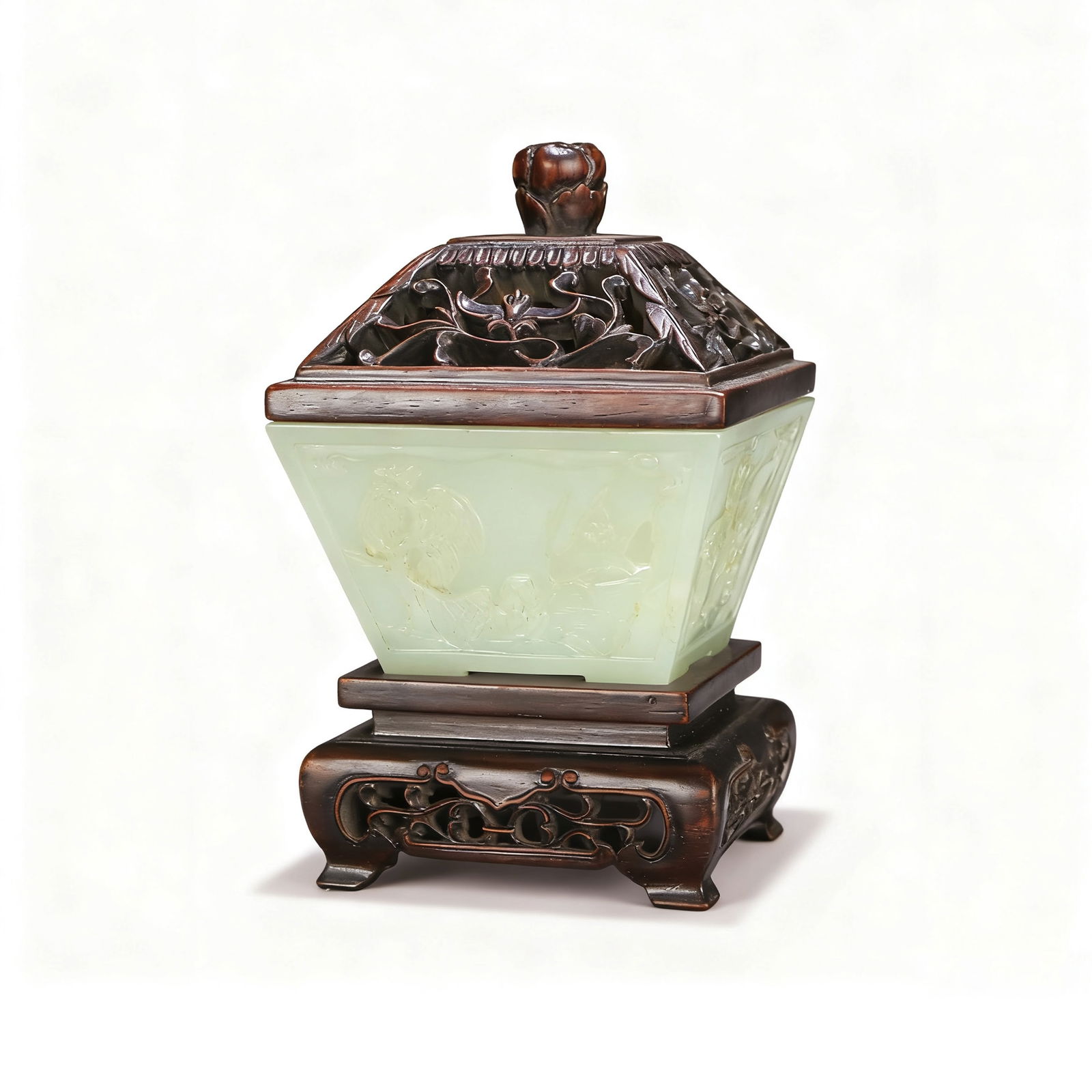 Hetian Jade Carved Flower Covered Box (with Redwood Lid and Stand): H:11cm W:6.5cm This is a Hetian jade carved flower covered box with a redwood lid and stand. The jade is warm and delicate in texture, with a soft and lustrous color. The box body is carved with