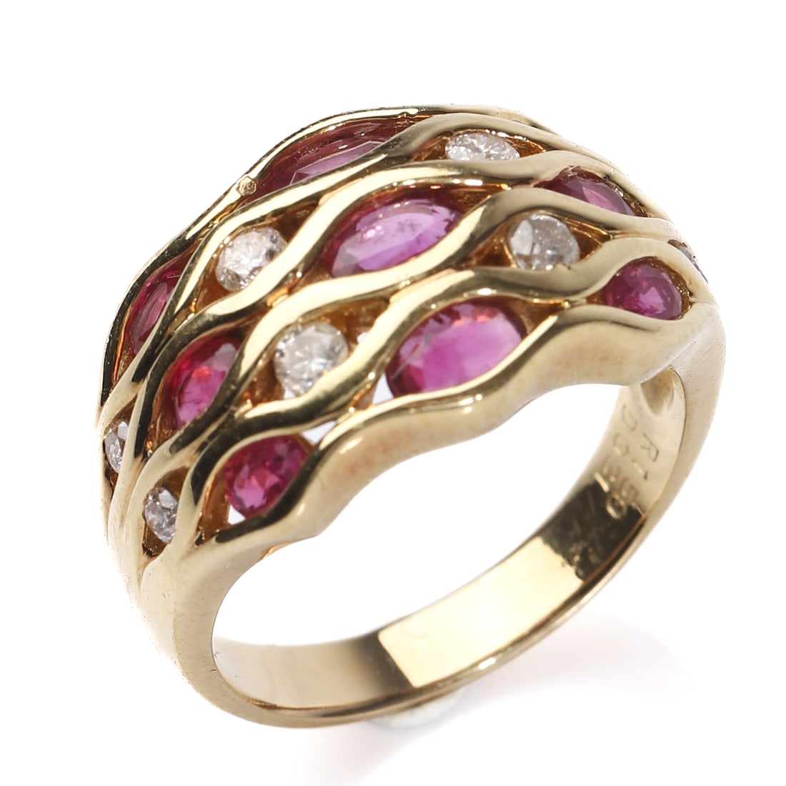 RETRO 18K GOLD RUBY AND DIAMOND RING: Dimensions Inner diameter: 11/16 in (17 mm); Weight: 8.3 g Description A Retro-period 18K gold ring set with approximately 1.50 carats of rubies and 0.31 carats of diamonds. The design features flowin