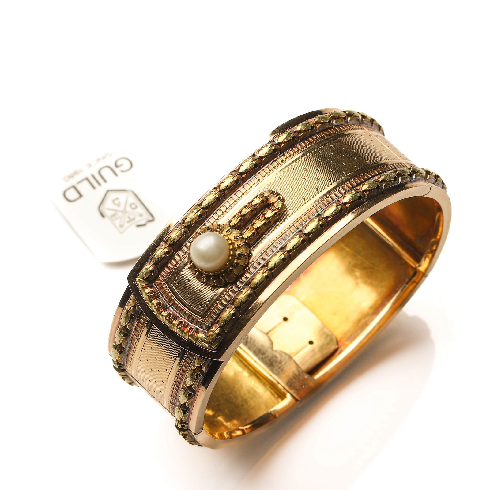 NAPOLEON III FRENCH MULTICOLORED CHASED GOLD AND NATURAL PEARL BANGLE BRACELET: Dimensions Inner diameter adjustable approx. 1 7/8–2 5/16 in. (48–58 mm), suitable for wrist circumference up to approx. 6 1/4 in. (16 cm).Weight: approx. 41 g. Description This exceptional