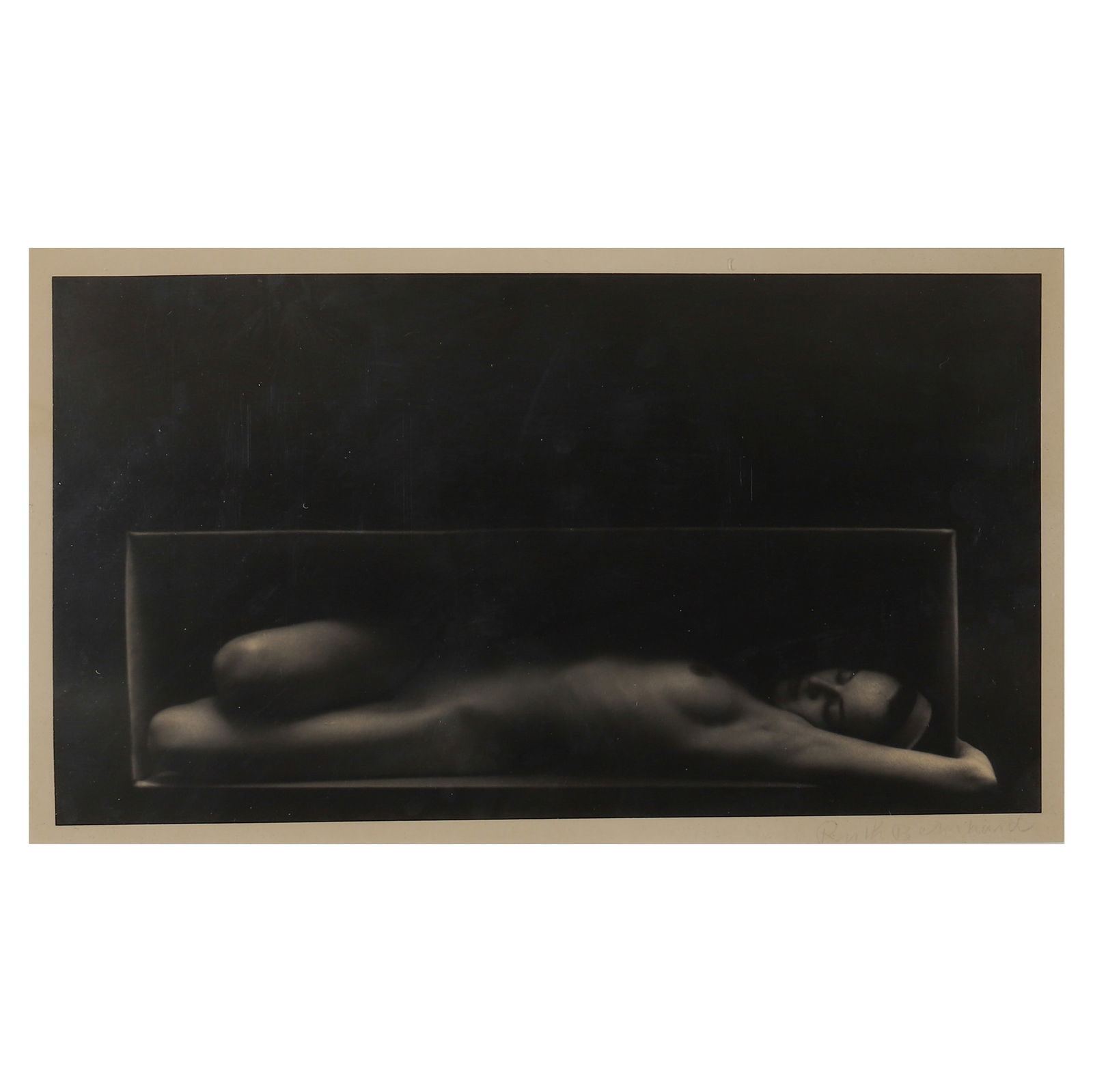 RUTH BERNHARD (1905-2006) NUDE: Artist RUTH BERNHARD Title: IN THE BOX (HORIZONTAL) Material: Gelatin silver print, mounted on board Signature: Signed “Ruth Bernhard,” lower right Dimensions Photograph 7 × 12 5/8 in. (17.7