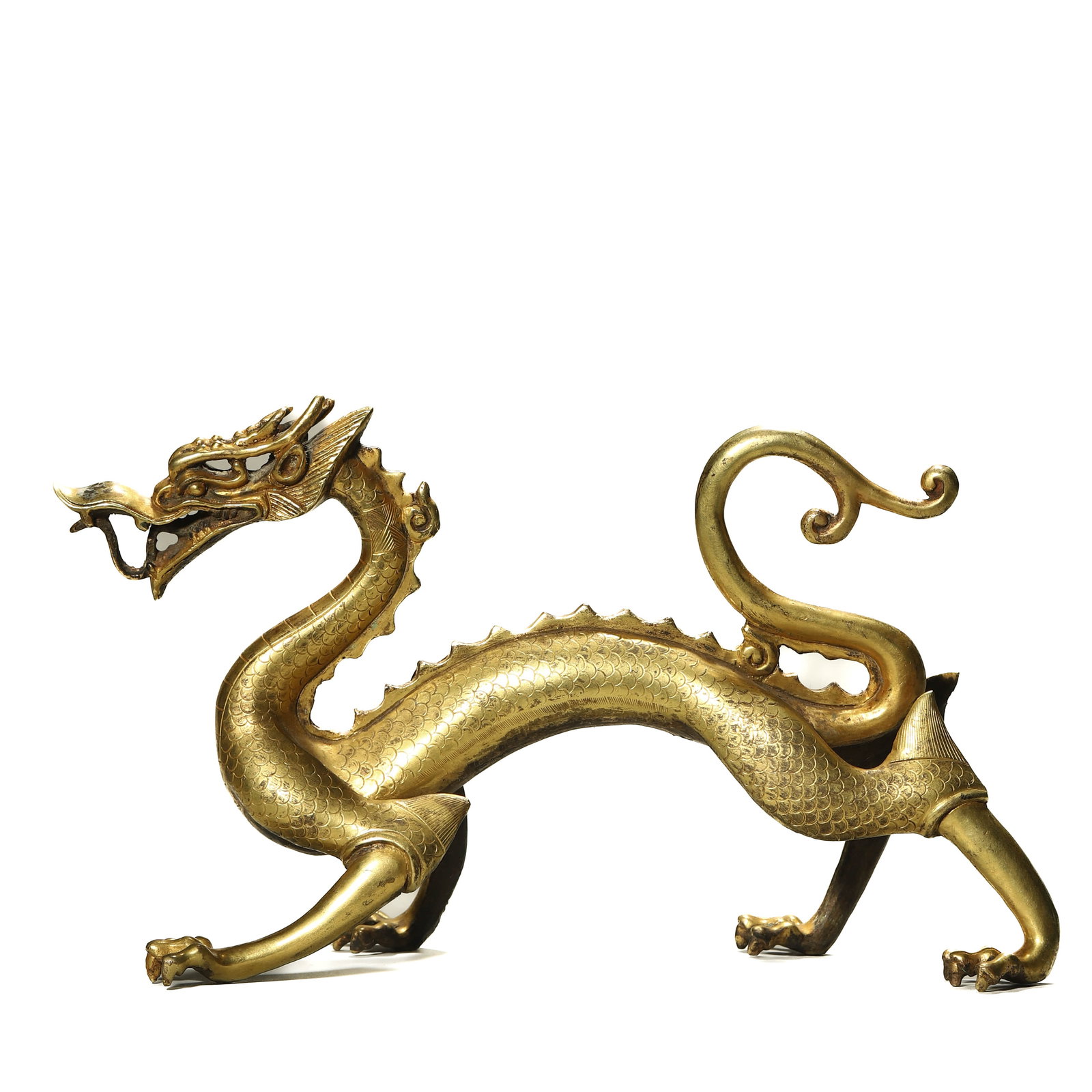 GILT-BRONZE FIGURE OF A DRAGON: Length 9 7/8 in, Height 5 1/2 in (25 × 14 cm)