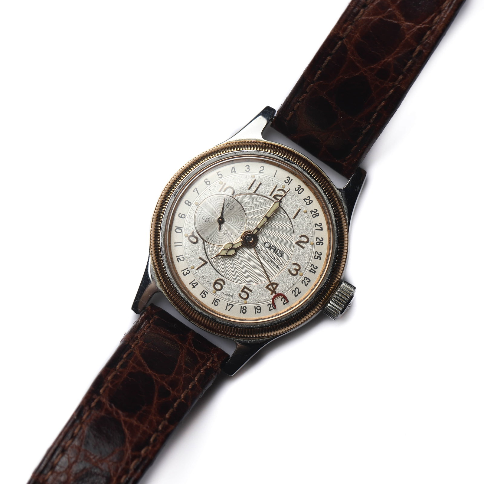 ORIS AUTOMATIC POINTER DATE WRISTWATCH: Dimensions Dial diameter: 1 7/16 in (36.3 mm); Overall length: 10 1/4 in (26cm) Description A classic Oris automatic pointer date wristwatch, distinguished by its richly detailed dial and