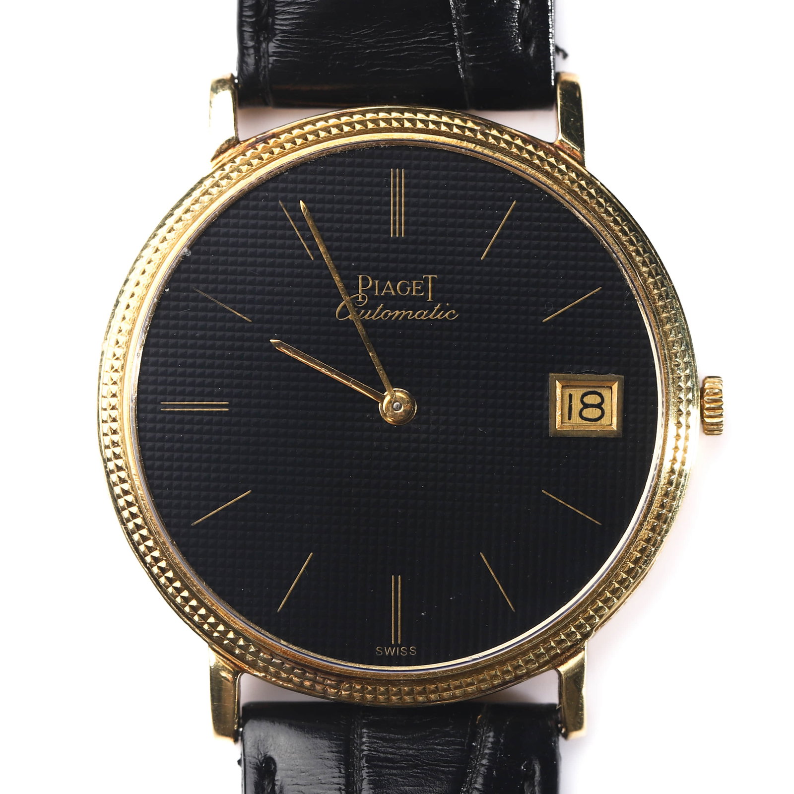 PIAGET AUTOMATIC GOLD WRISTWATCH: Dimensions: Case diameter: 1 5/16 in. (33.4 mm); overall length approx. 8 15/32 in. (21.5 cm). Description An elegant Piaget automatic wristwatch featuring a finely textured black dial signed Piaget
