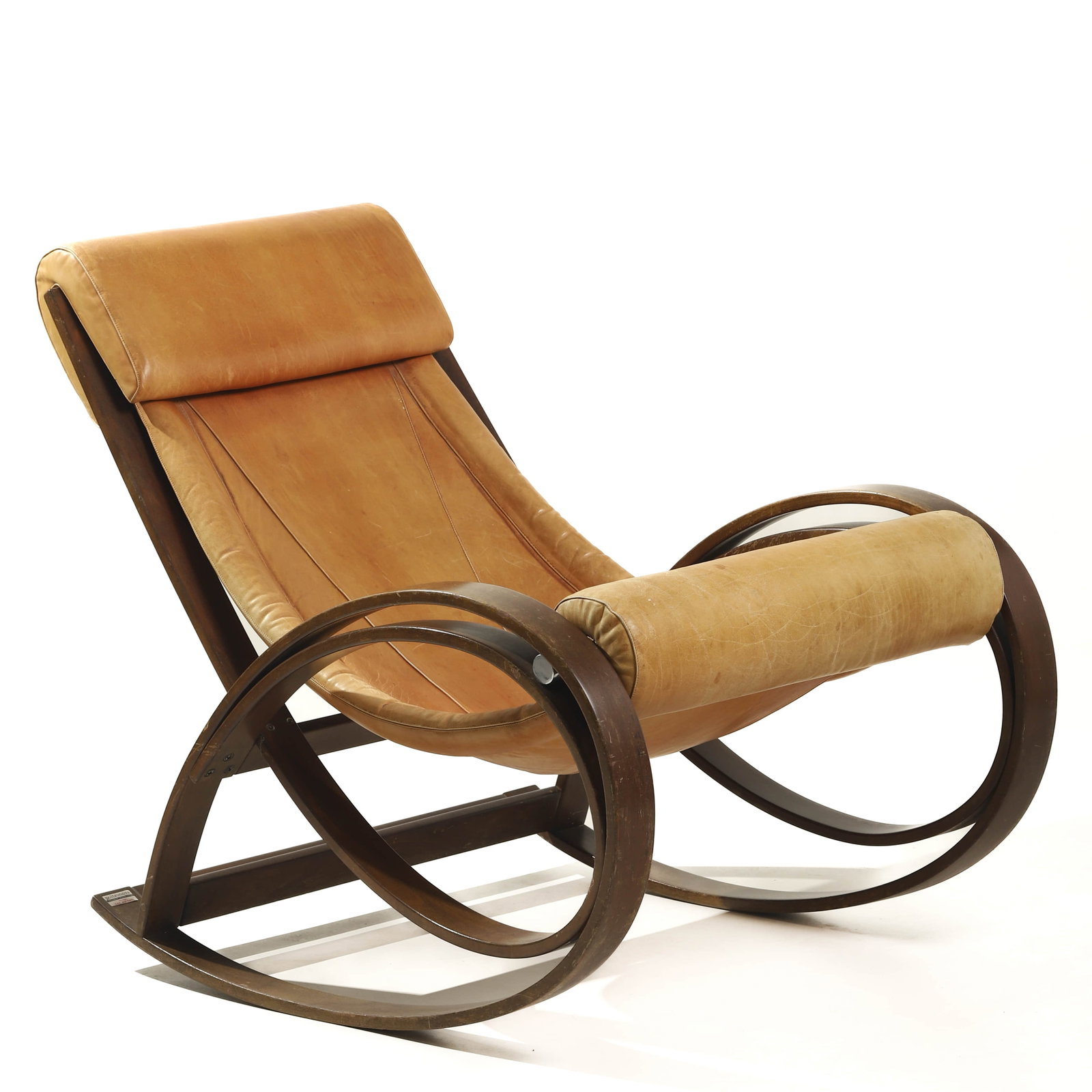 GAE AULENTI FOR POLTRONOVA ROCKING CHAIR, ITALY, MID-20TH CENTURY: Dimensions Length: 43 1/4 in (110 cm); Width: 28 3/4 in (73 cm); Height: 33 7/8 in (86 cm) Description This sculptural rocking chair, designed by renowned Italian architect and designer Gae Aulenti