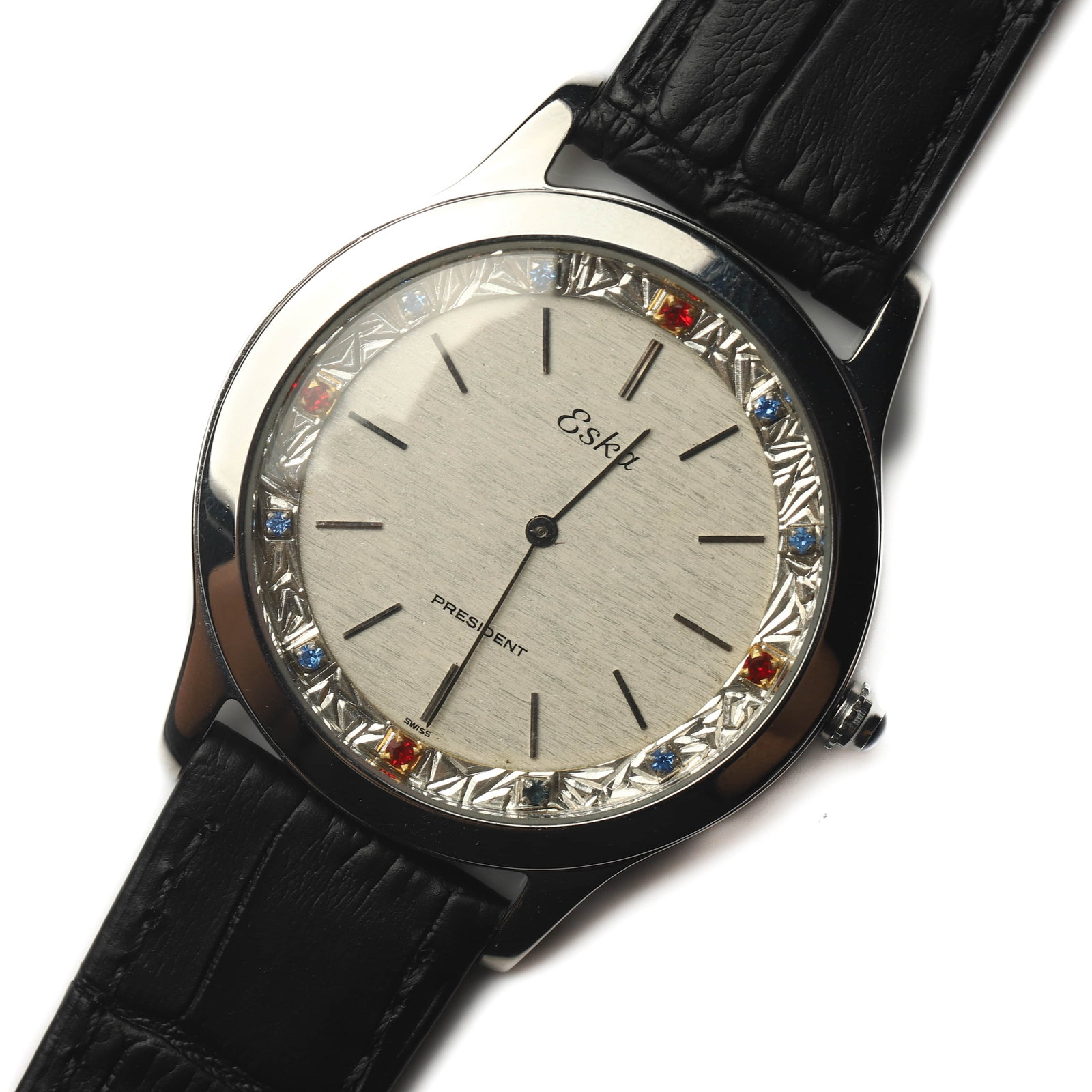 ESKA PRESIDENT MANUAL WIND WRISTWATCH: Dimensions Overall Length 9 5/8 in. (24.5 cm) Case Diameter 1 11/16 in. (4.28 cm) Weight 40 g Description A vintage Eska President manual wind wristwatch featuring a brushed silver-tone dial with