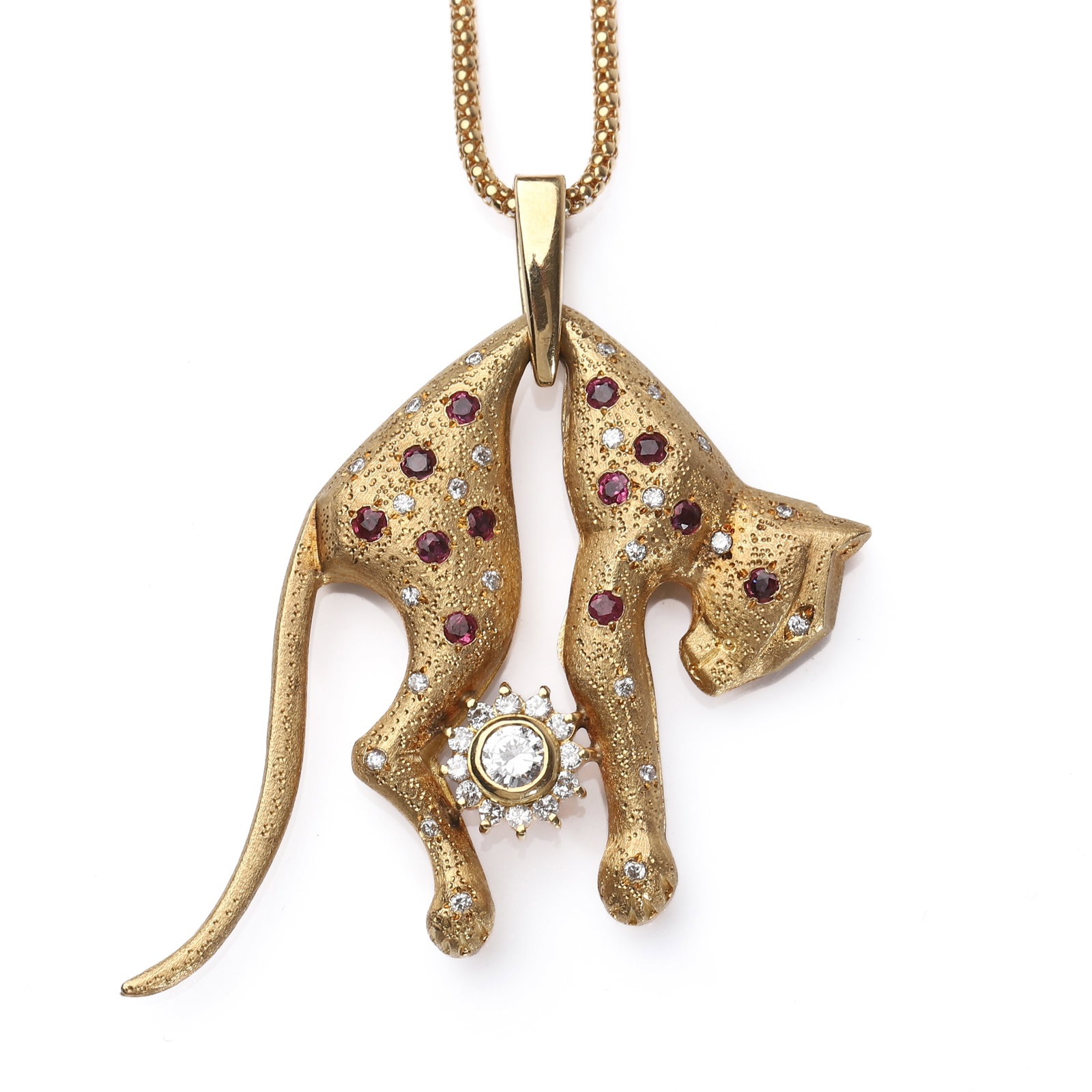 GOLD PANTHER PENDANT NECKLACE WITH RUBIES AND DIAMONDS: Dimensions Length: 31.9 cm; Weight: 32.5 g Description A finely crafted 18k gold pendant necklace featuring a stylized panther rendered with a matte-textured finish. The panther’s body is accented
